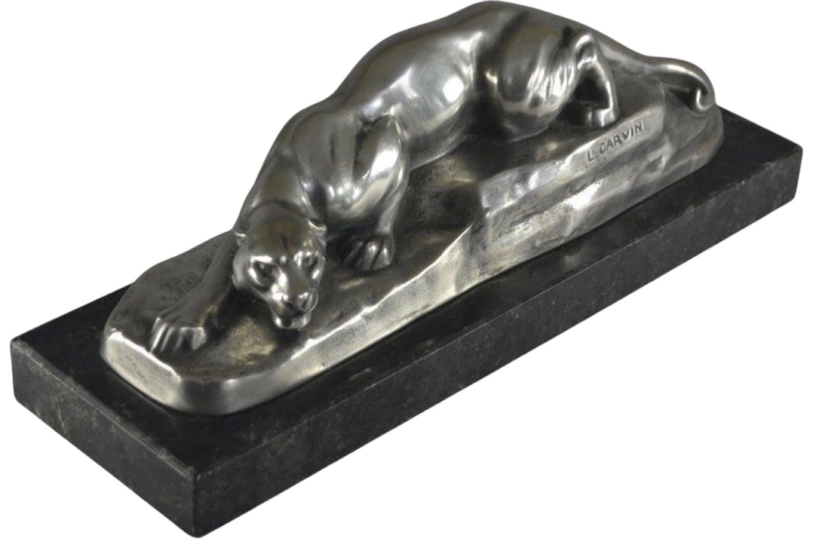 Louis Carvin Cubist bronze prowling panther silver-plated on a black marble base. Louis Carvin was a renowned French sculptor known for his contributions to the Cubist movement. He was born on January 14, 1875, in Paris, France, and passed away on