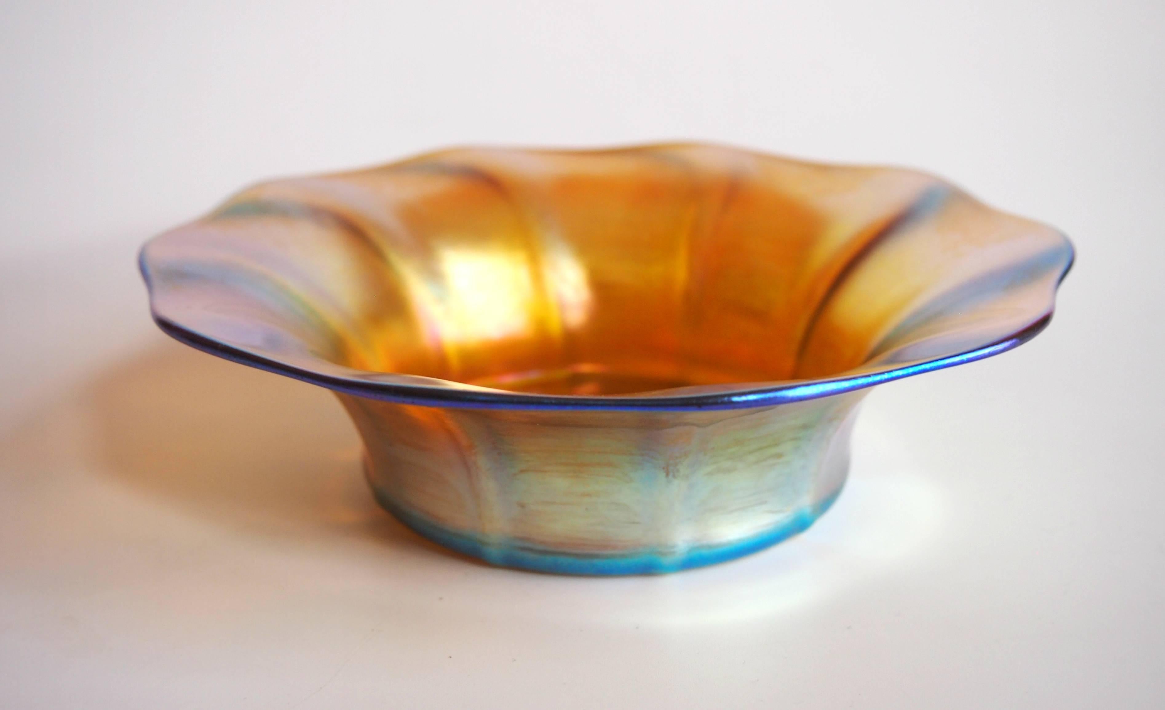 A fine Art Nouveau Louis Comfort Tiffany ribbed favrile finger bowl/dish, super iridescence with highlights of gold, pink, blue and green. Nicely signed L. C. Tiffany - Favrile. to the base - see image 6.