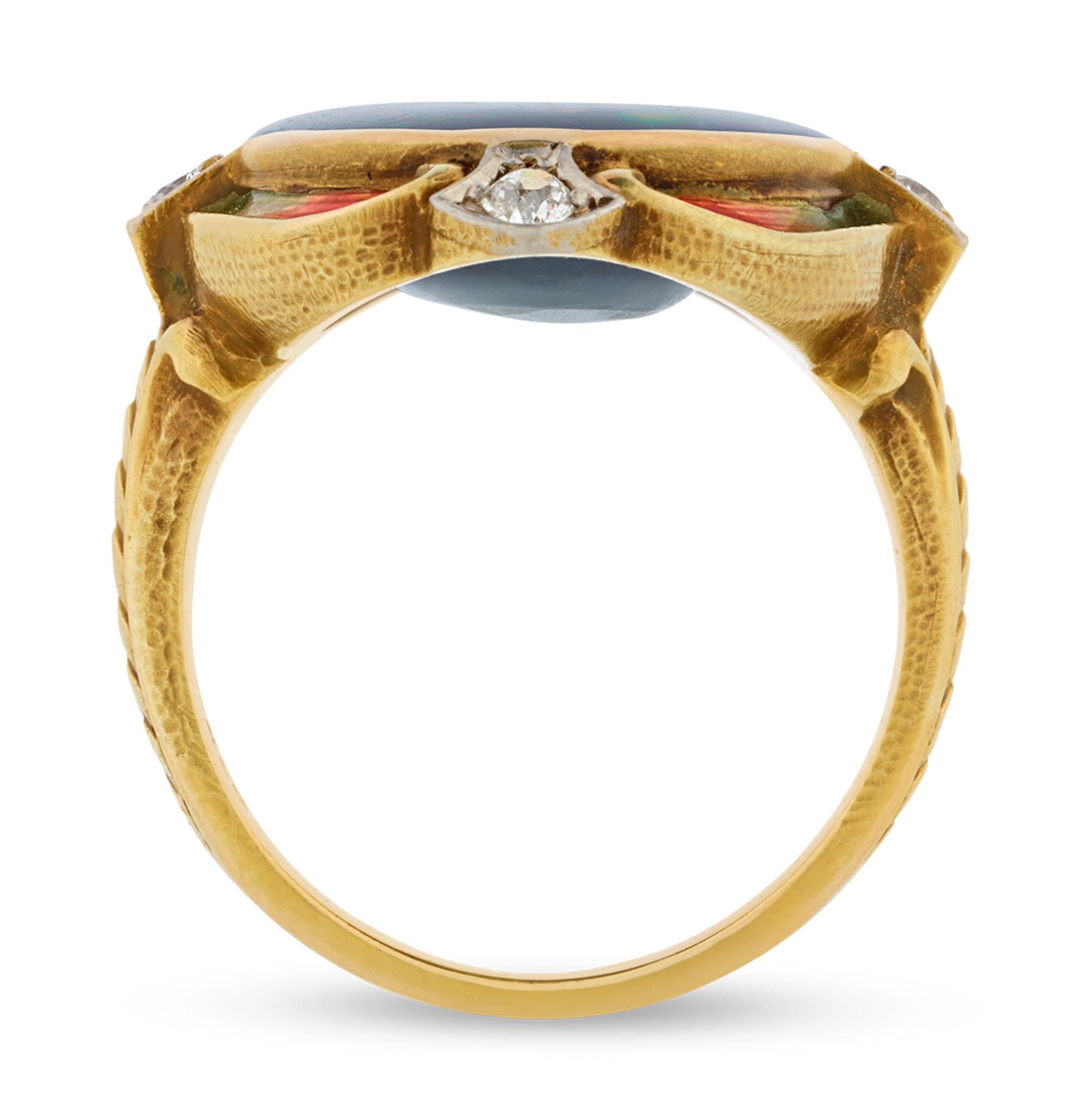 A rare and stunning example of Louis Comfort Tiffany's artistic brilliance, this ring encapsulates his passion for color, light and nature. At its heart lies a mesmerizing cabochon black opal, weighing approximately 5.50 carats, displaying an