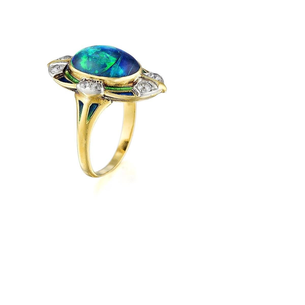 An American Art Nouveau 18 karat gold ring with black opal, diamonds, and blue and green enamel by Louis Comfort Tiffany. The ring has a black opal with an approximate weight of 2.20 carats and 8 old European-cut diamonds with an approximate total