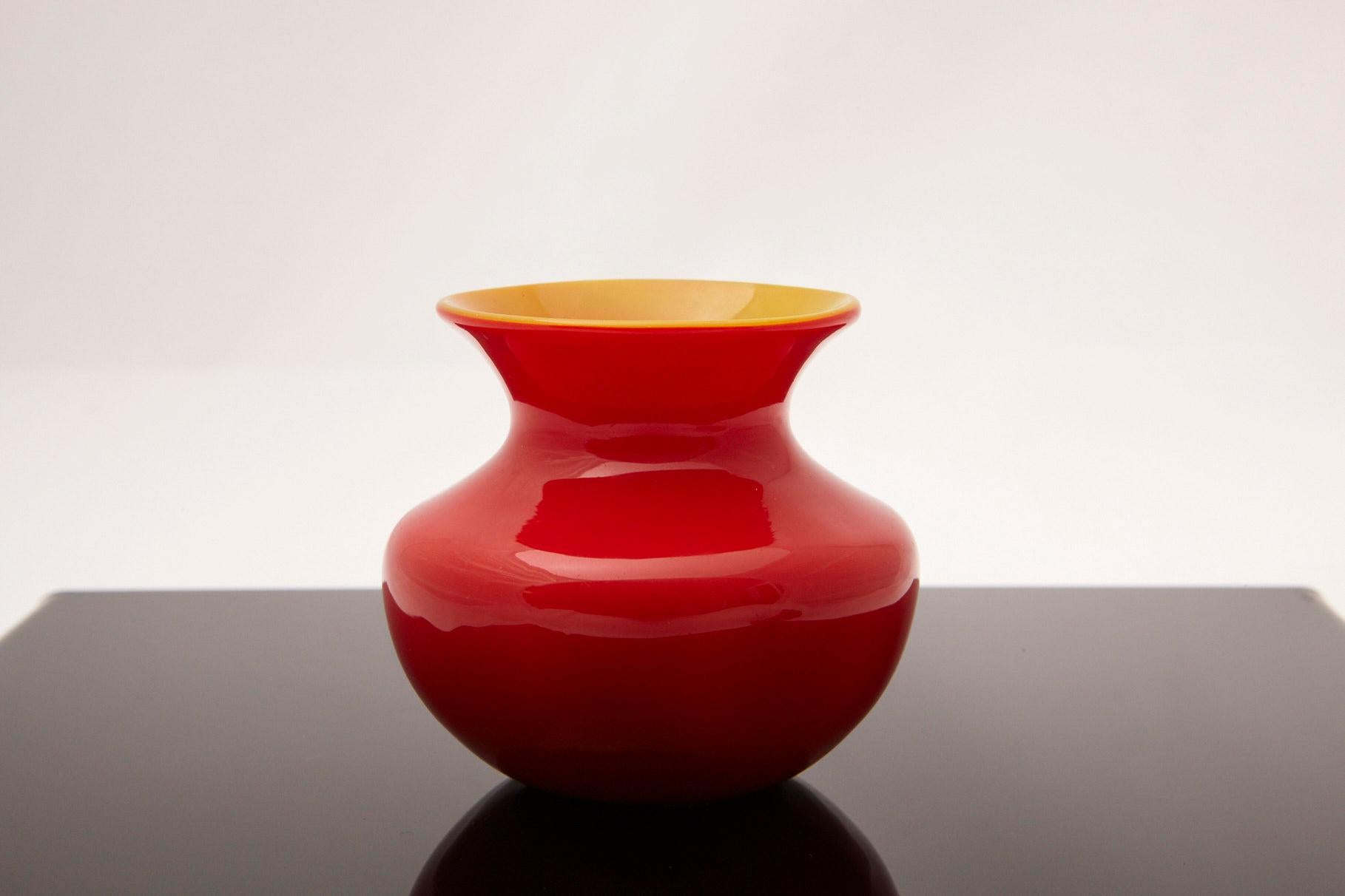 Lovely petite Tiffany Favrile cased red yellow glass miniature vase, circa 1915. 
The vase is signed on the underside L.C.Tiffany - Favrile 656 F. The initials L.C. stand for Louis Comfort Tiffany.
The vase was purchased at a Sotheby's auction in
