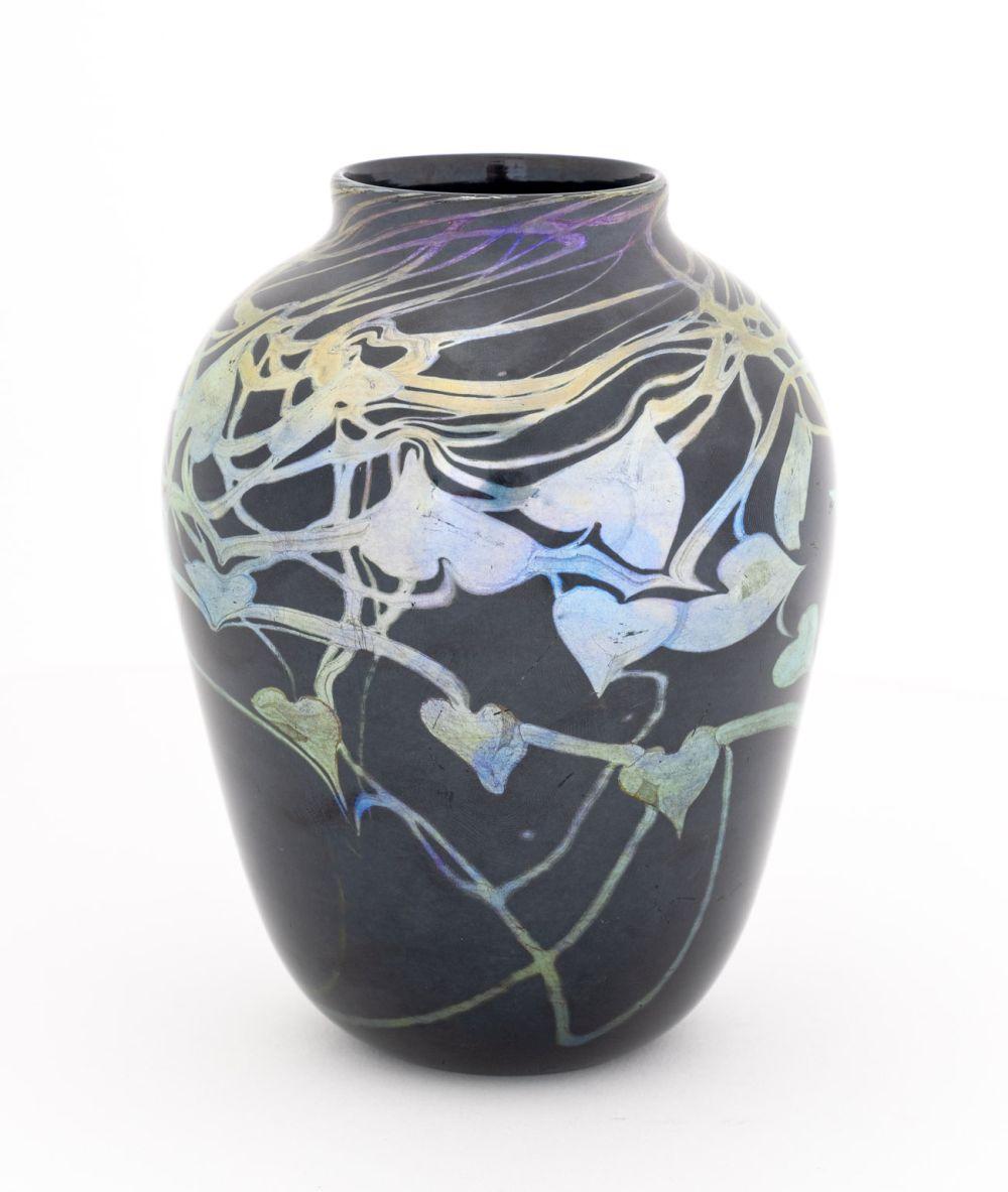 Louis Comfort Tiffany Favrile Glass Vase, 1895-1915, the ovoid body with deep green ground and mirror black iridescence, silver and blue leaf and vine decoration, incised 