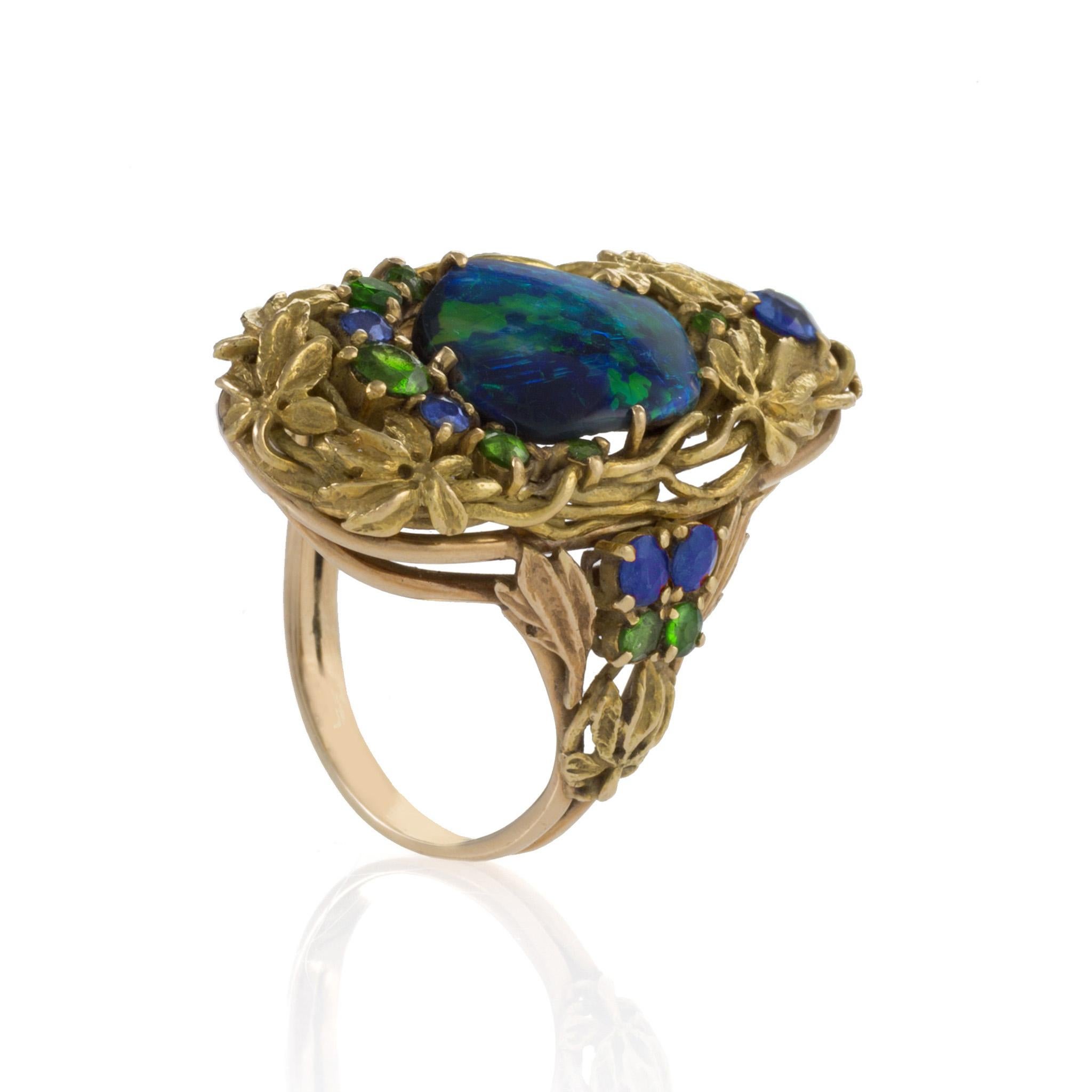 Set with a natural-form black opal, encircled by gold grapevines and conforming leaf and vine motifs, this gorgeous Tiffany & Co. ring by Louis Comfort Tiffany is a miniature ode to nature. The leafy grapevines set with opals was a favored motif in
