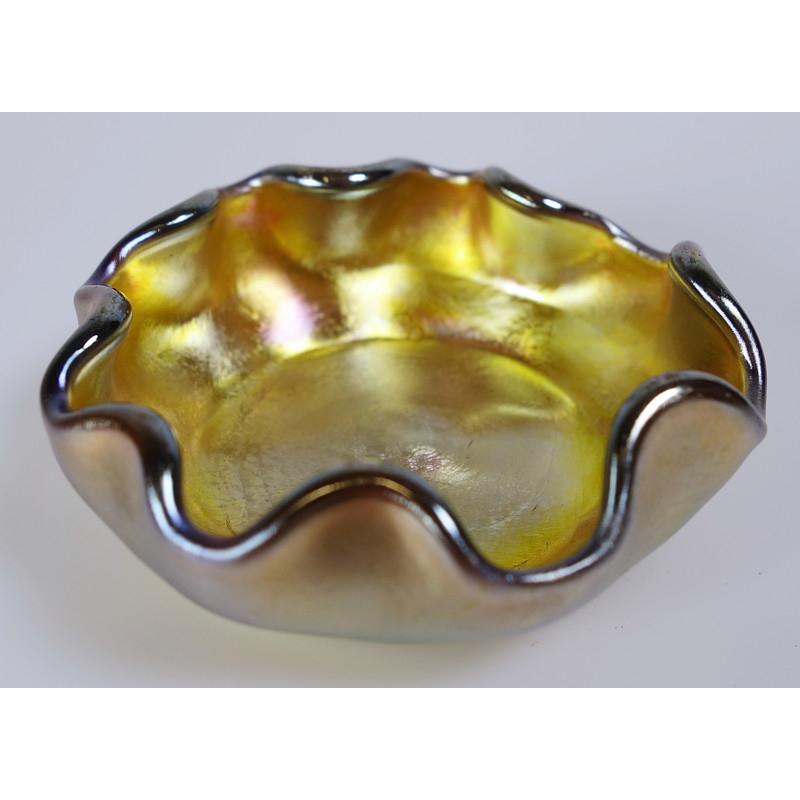 Offering this diminutive Louis Comfort Tiffany gold Favrile iridescent art glass salt dish. This dish features a 