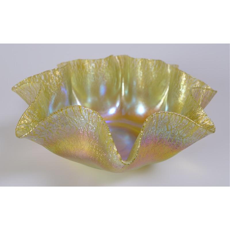 Offering this diminutive Louis Comfort Tiffany gold Favrile iridescent art glass bowl. This bowl features a fluted, ribbon edge with 