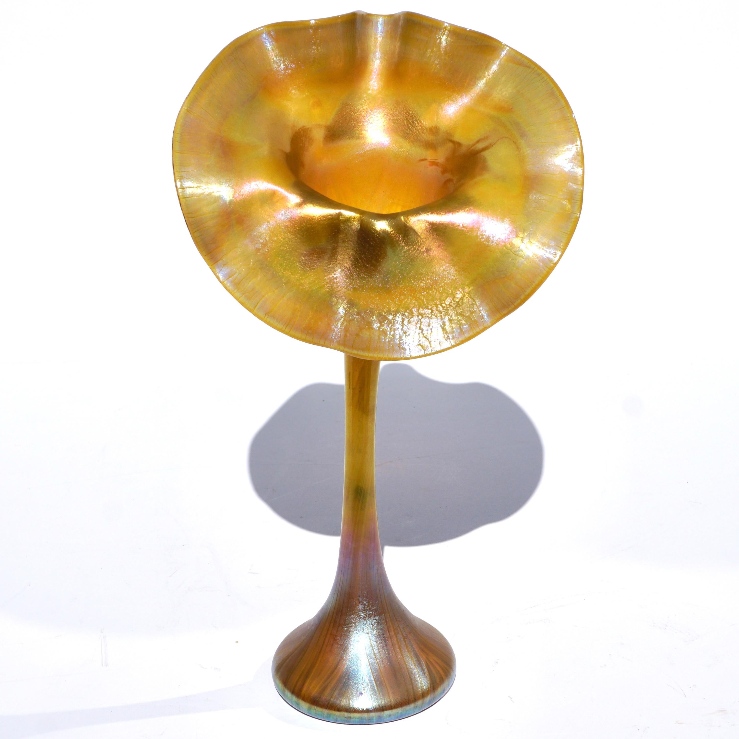 Louis Comfort Tiffany Studios Early Jack In the Pulpit vase. Circa 1895 Art Nouveau. A early and rare Favrile decorated pulled feather floriform flared iridescent vase. New York, NY

Signature: Original paper label, unsigned.

Hight: 13