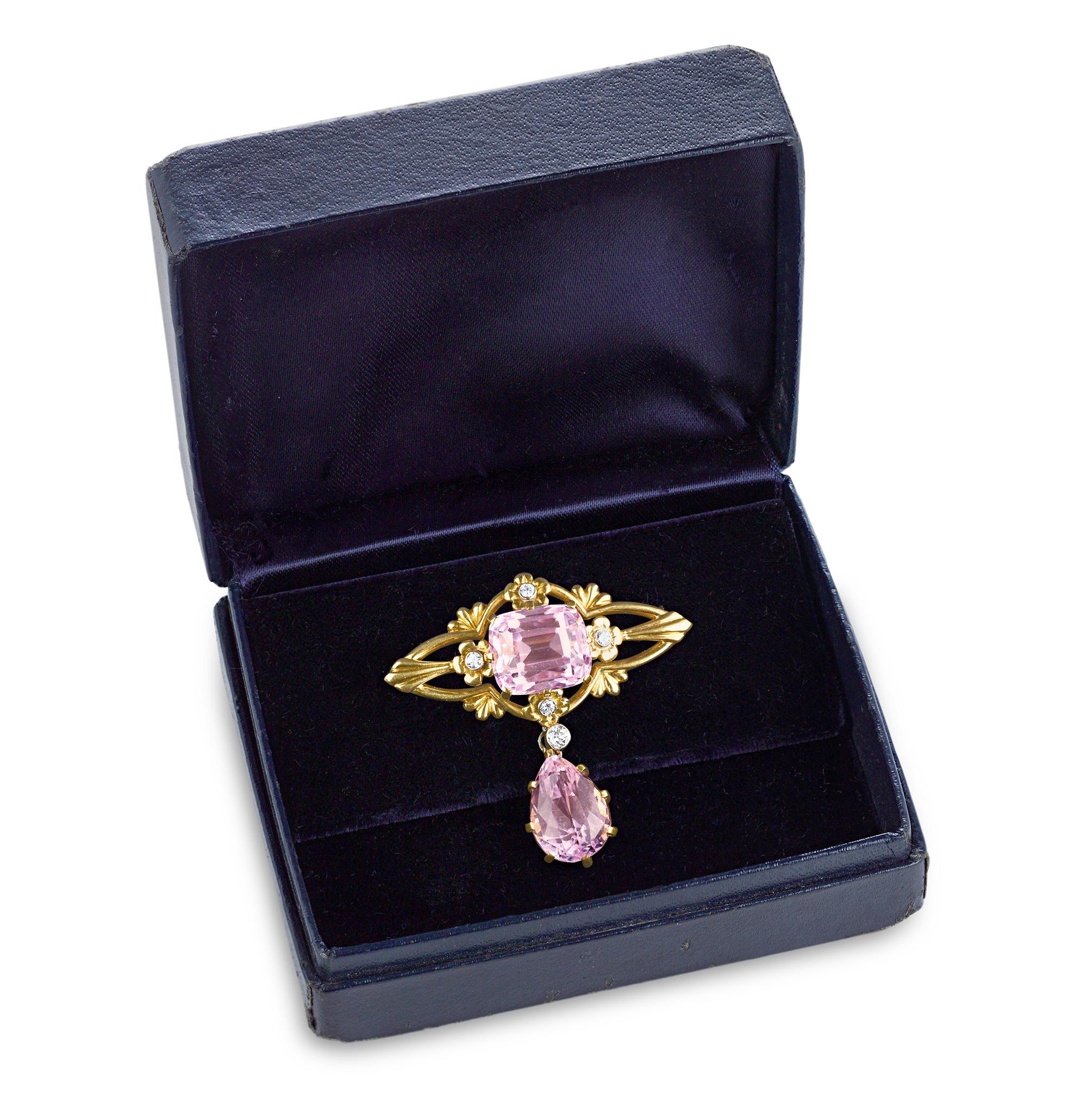 This stunning brooch was crafted by the legendary artist and designer Louis Comfort Tiffany for Tiffany & Co. Featuring two sparkling kunzite gems totaling 17.25 carats and a delicate floral setting, this brooch is a quintessential design by the Art