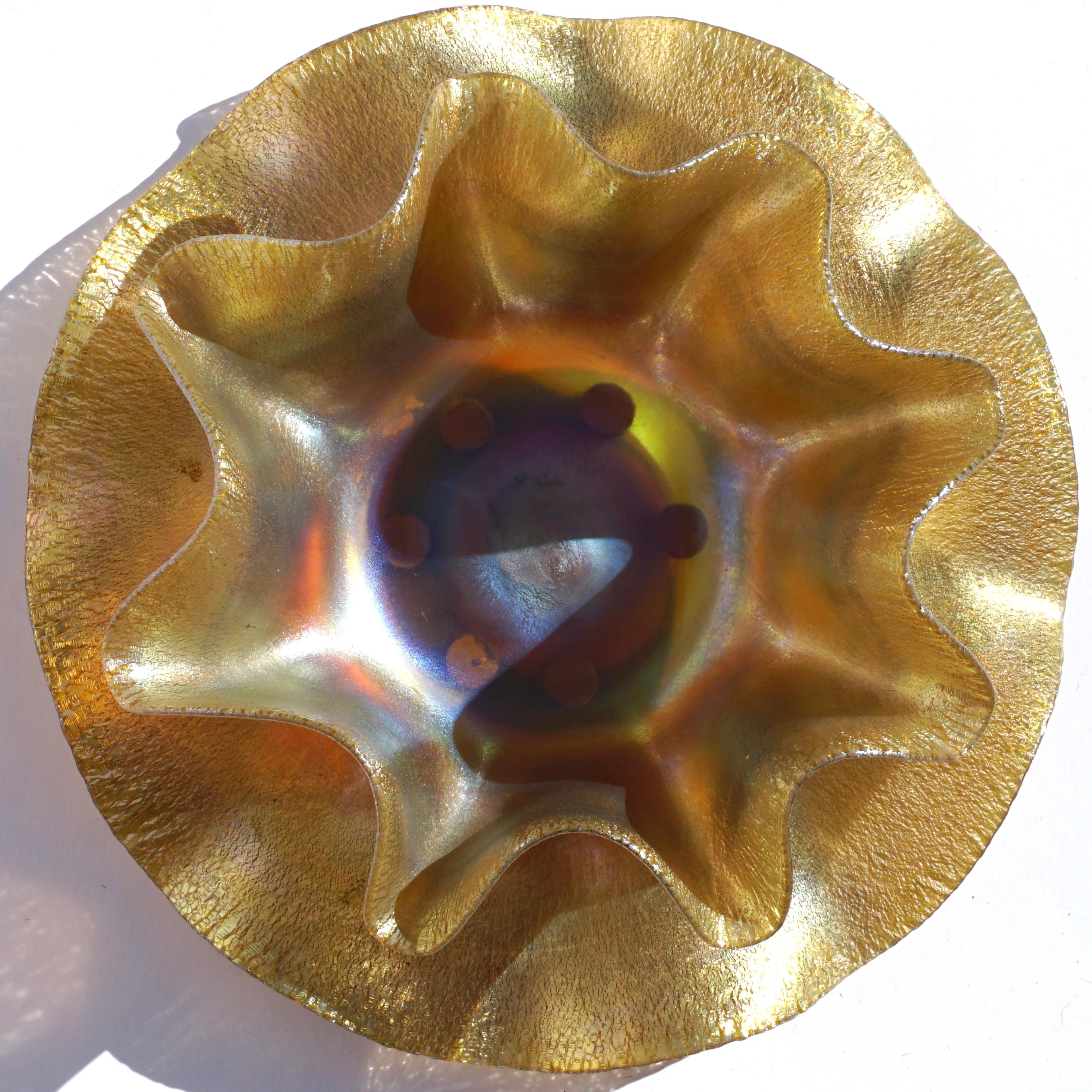 Louis Comfort Tiffany L.C.T. gold aurene stretched glass onion skin ruffle bowl, circa 1900

Bowl measures approximately 2.5 inches high by 6 inches wide (at the widest point).
Plate measures approximately 7 inch diameter.

Outstanding original