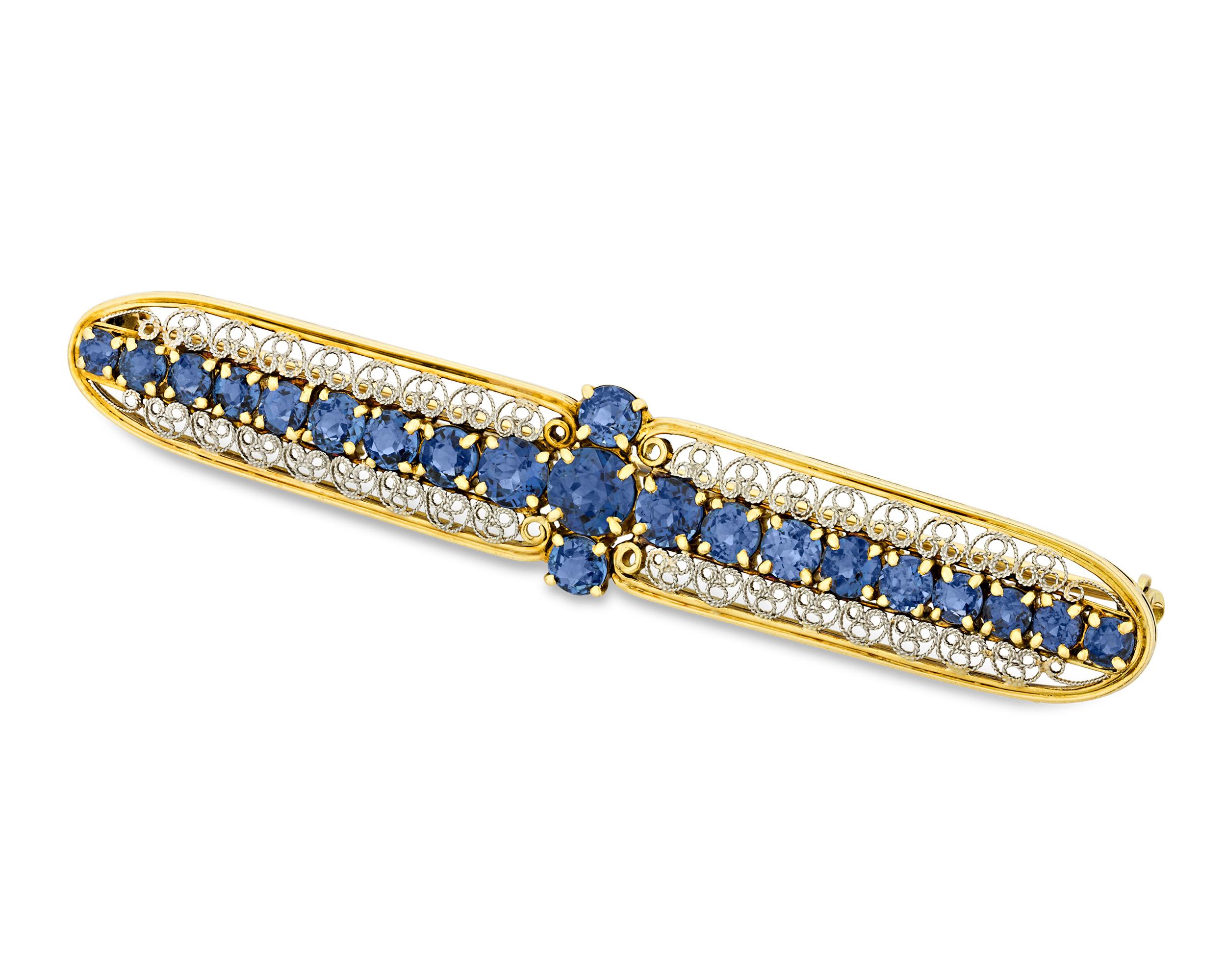 Velvet blue sapphires line this exquisite and incredibly rare brooch crafted by the legendary artist and designer Louis Comfort Tiffany for Tiffany & Co., An important and unique masterpiece of jewelry design, this delicately crafted pin showcases
