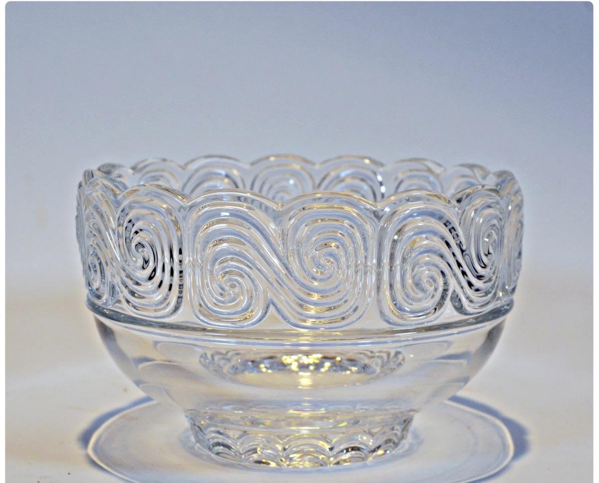 A gorgeous Louis Comfort Tiffany wave crystal bowl, circa 1950.
A brilliant acid etched wide wave pattern around the edge and around the base by Tiffany & Co., with very light wear.

Measures: 5