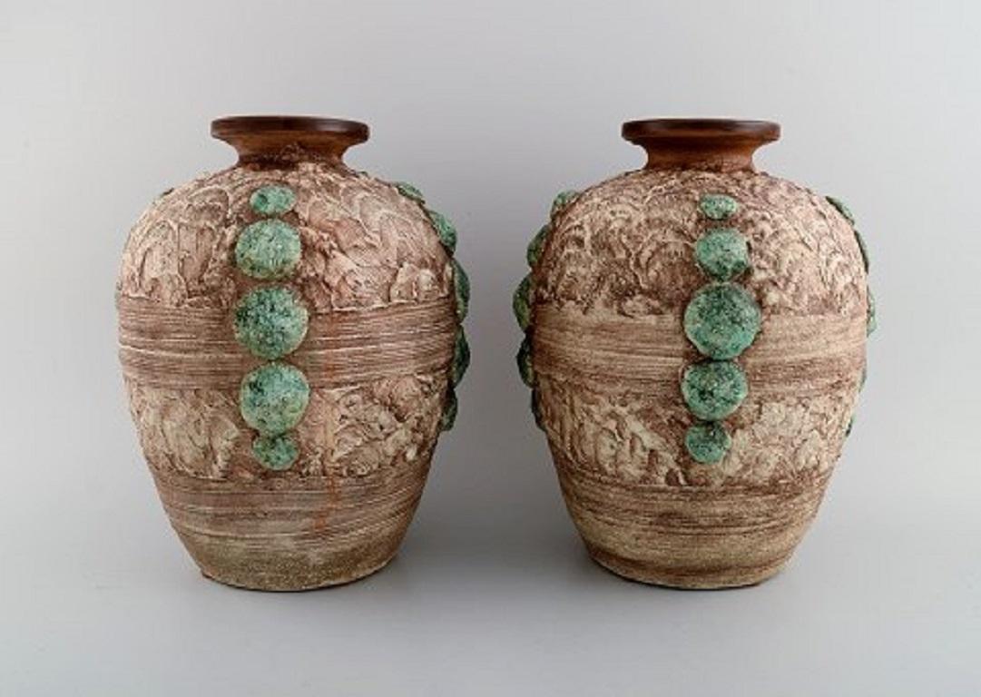 Louis Dage (1885-1961), French ceramist. Two large vases in glazed ceramics. 
Beautiful glaze in green and light earth tones. 1930s.
Measures: 27.5 x 22.5 cm.
In excellent condition.
Signed.