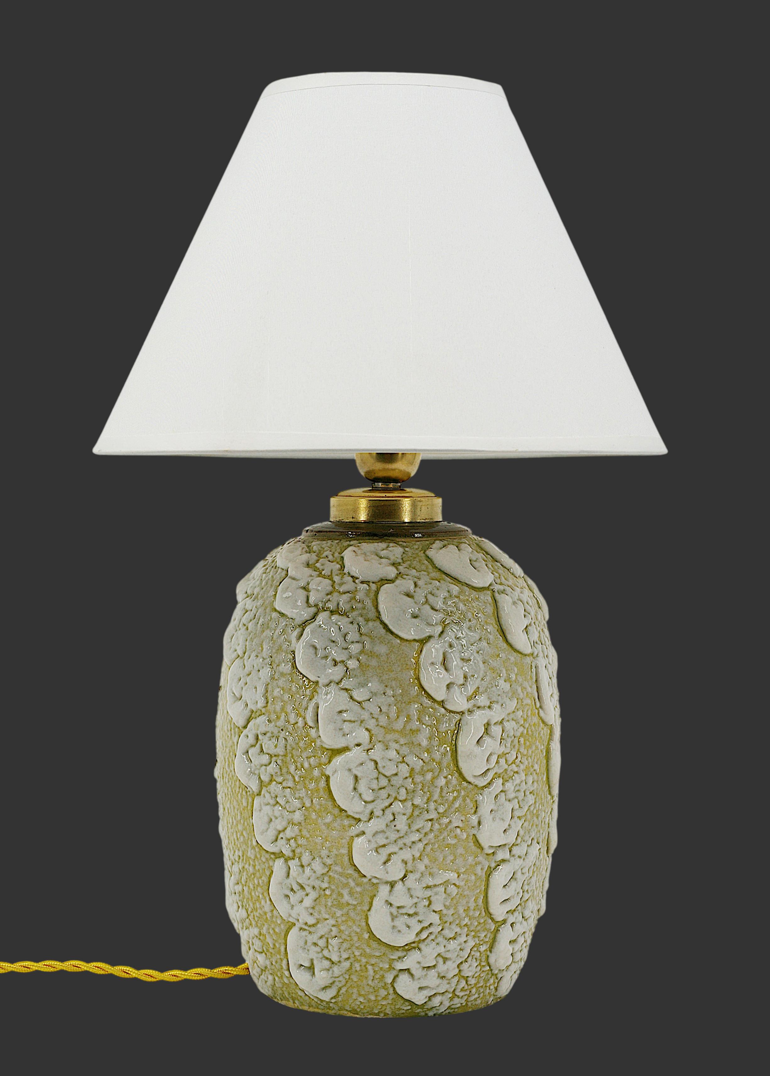 French Art Deco stoneware table lamp by Louis DAGE (Antony, Paris), France, Late 1920s. Stoneware, brass & fabric. Important enamel applications. Height: 15.75