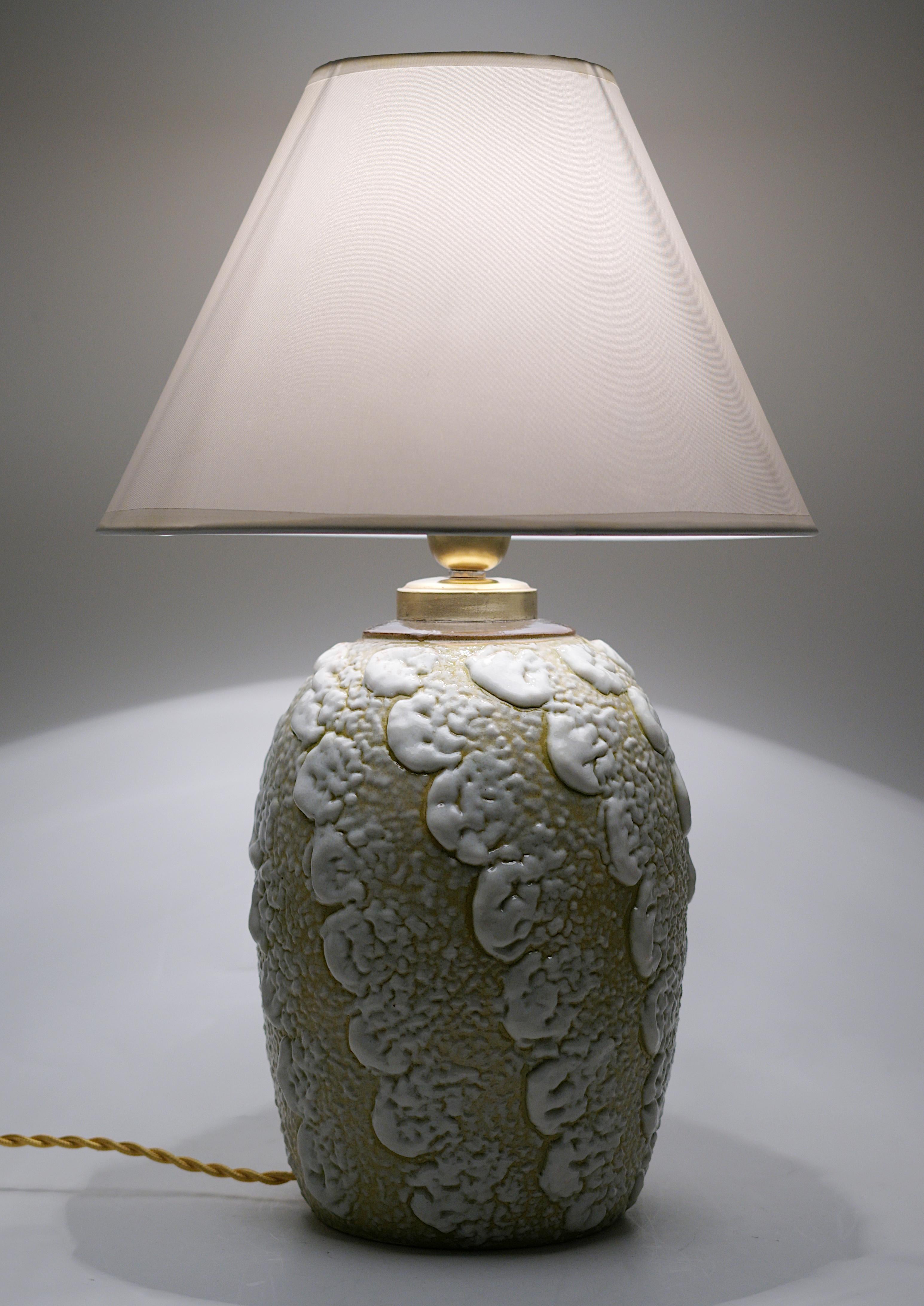 French Art Deco stoneware table lamp by Louis DAGE (Antony, Paris), France, 1920s. Stoneware, brass & fabric. Important enamel applications. Height: 15.75
