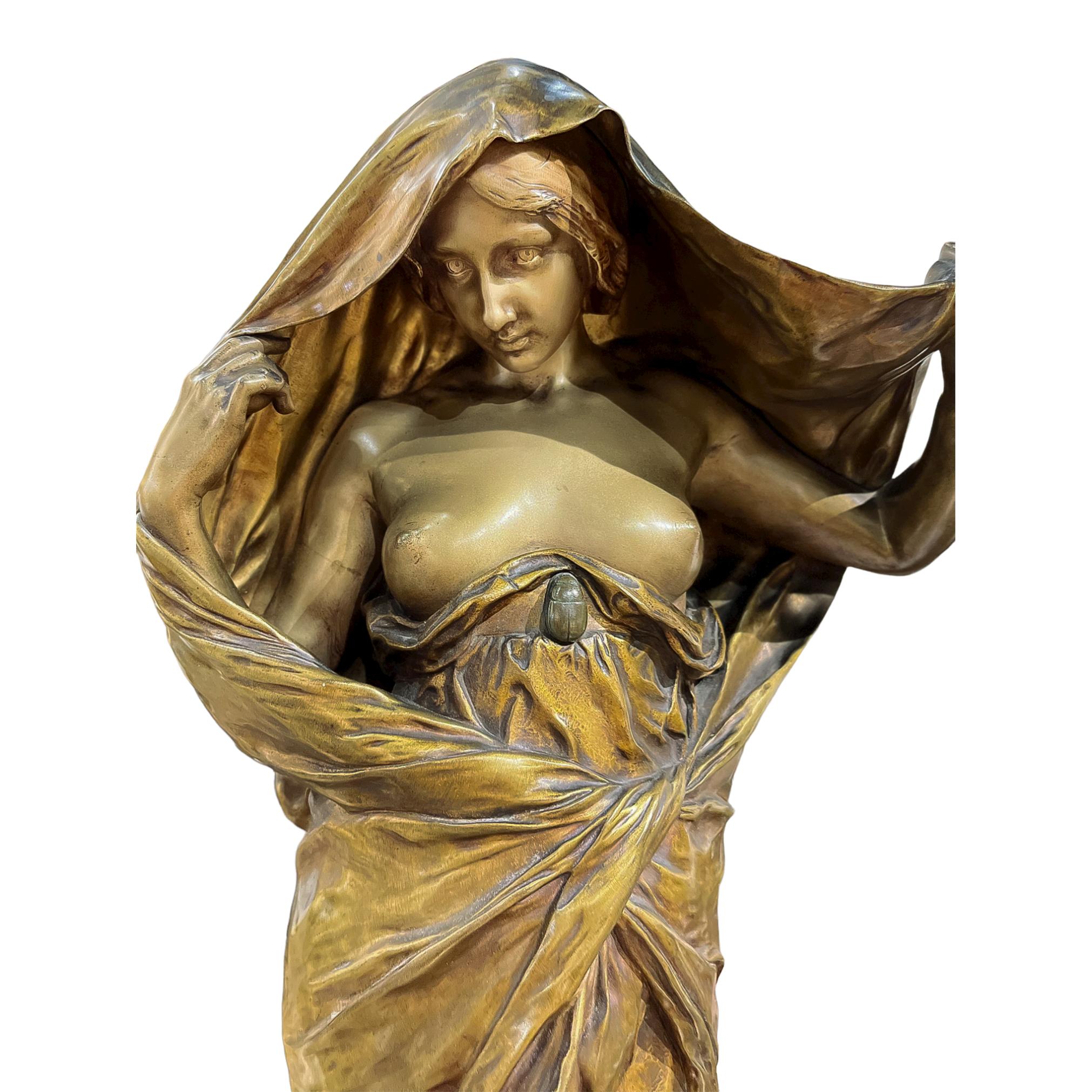 La Nature se dévoilant devant la Science (Nature revealing herself before Science)

Nature unsheathes herself from a golden cloak to reveal her chest with a beetle resting on her ribs.  

Artist : LOUIS-ERNEST BARRIAS (FRENCH, 1841-1905) 
inscribed