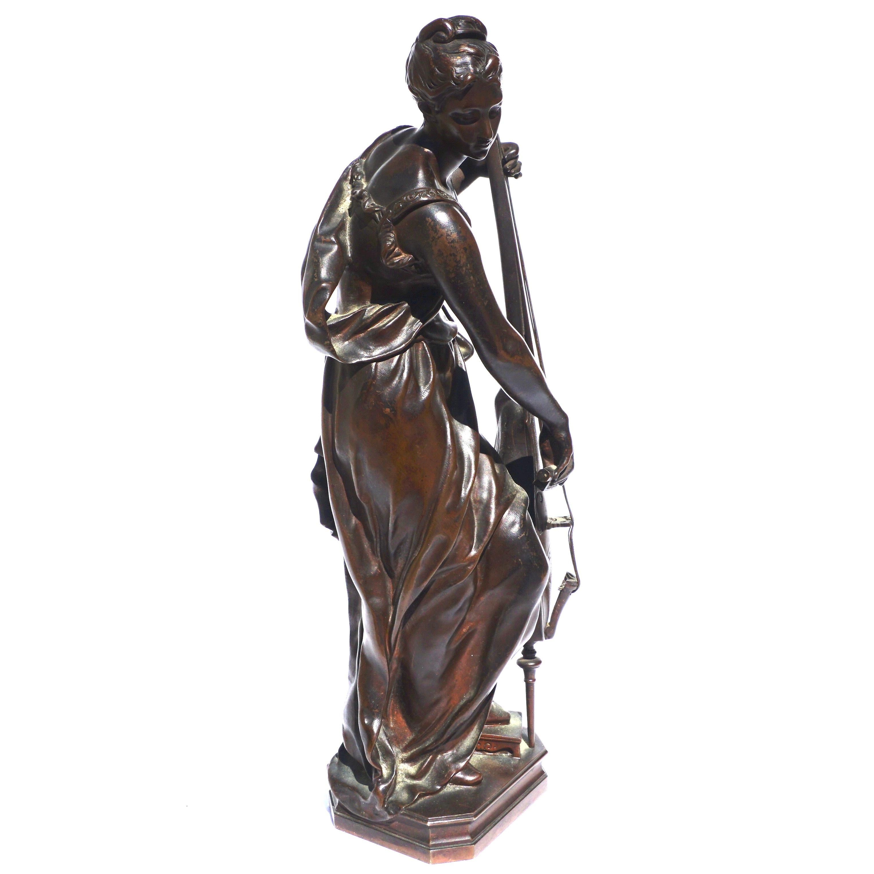 A French bronze figure of a girl playing a cello. Very rare as I have only seen one sold at Christies. Beautiful rich brown patina with amazing chiseling and detail throughout. Unfortunately; her bow has been lost through the ages. A rare and