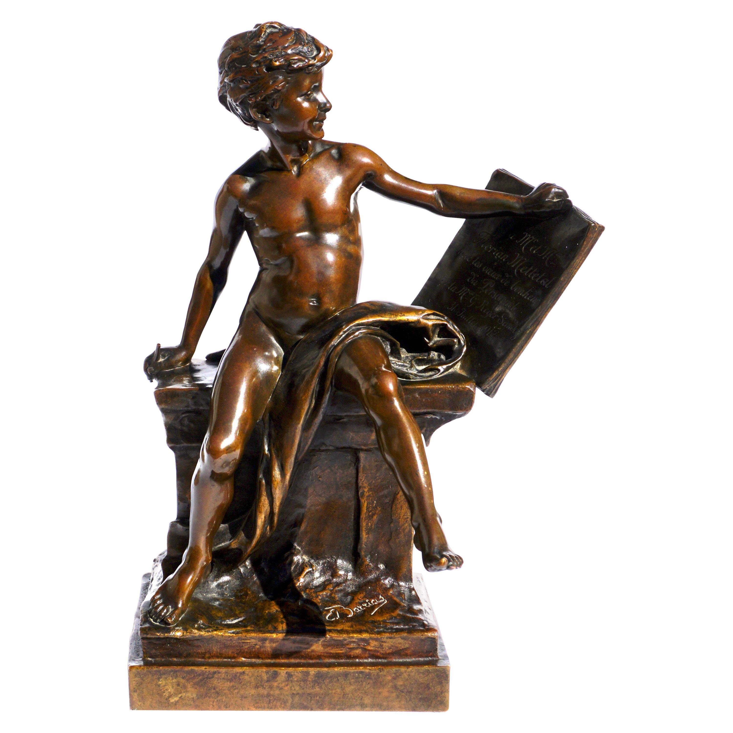 French dore bronze depicting a seated figure of a boy with tablet by Louis Ernest Barrias, French(1841-1905) Circa 1912 

Modeled as a partially nude youth seated with a tablet and pen, incised E. Barrias and Susse Frères and Susse Frères pastille