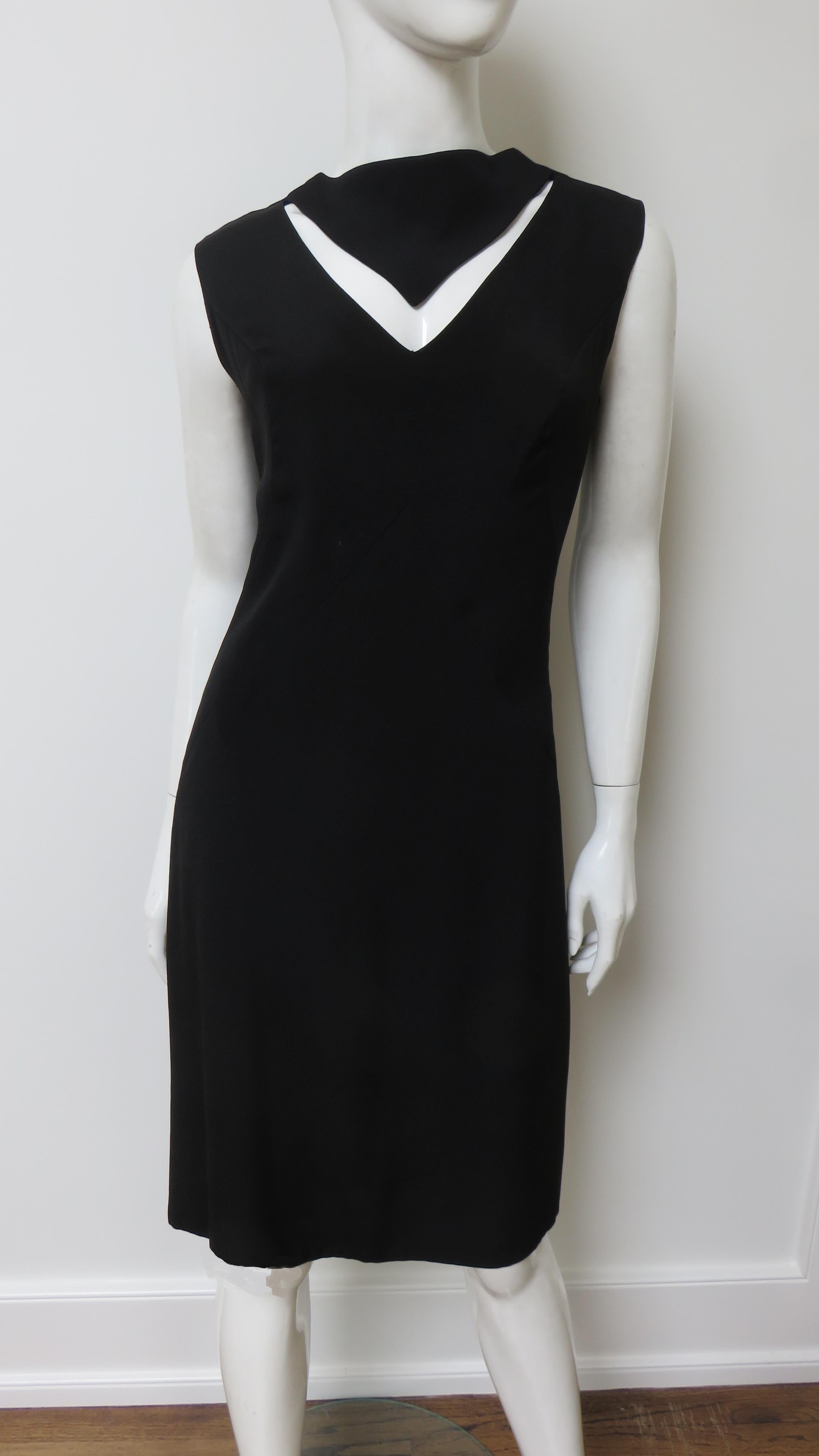 A fabulous little black dress from Louis Estevez.  It is a simple sleeveless A line dress with V cut out at the front neckline and some clever seaming enhancing the bust and waist. It is fully lined, and has a center back zipper.
Fits sizes Small