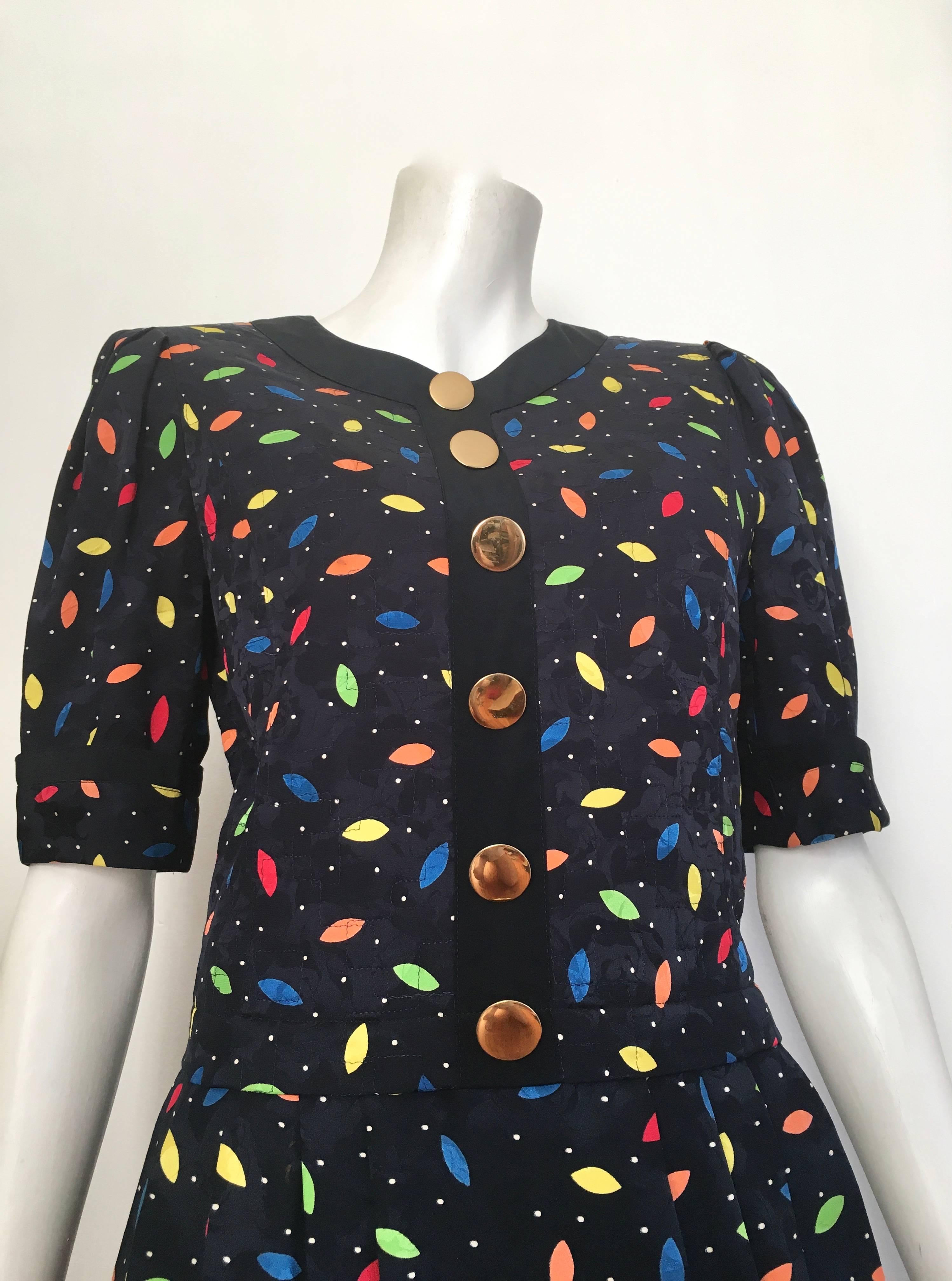 Louis Feraud 1980s silk navy short sleeve dress is a size 6. Ladies please grab your most trusted friend, Mr. Tape Measure, so you can measure your bust, waist & hips to make certain this vintage treasure will fit your lovely body.  Colorful &