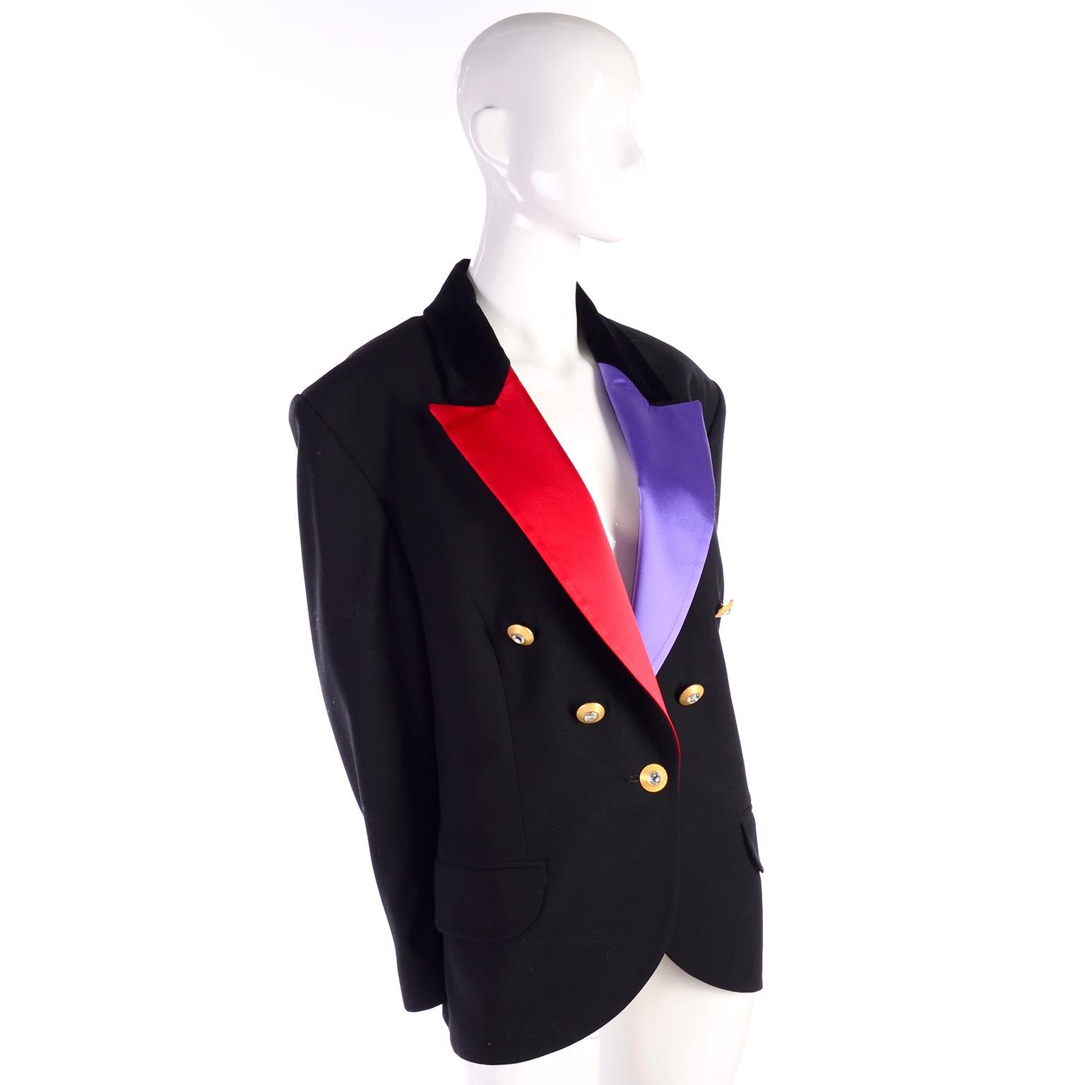 This is an incredible Louis Feraud vintage black wool tuxedo style jacket with contrasting red and purple satin lapels.  This blazer has faux front pockets, is fully lined and has incredible heavy gold buttons with clear rhinestone crystal centers. 