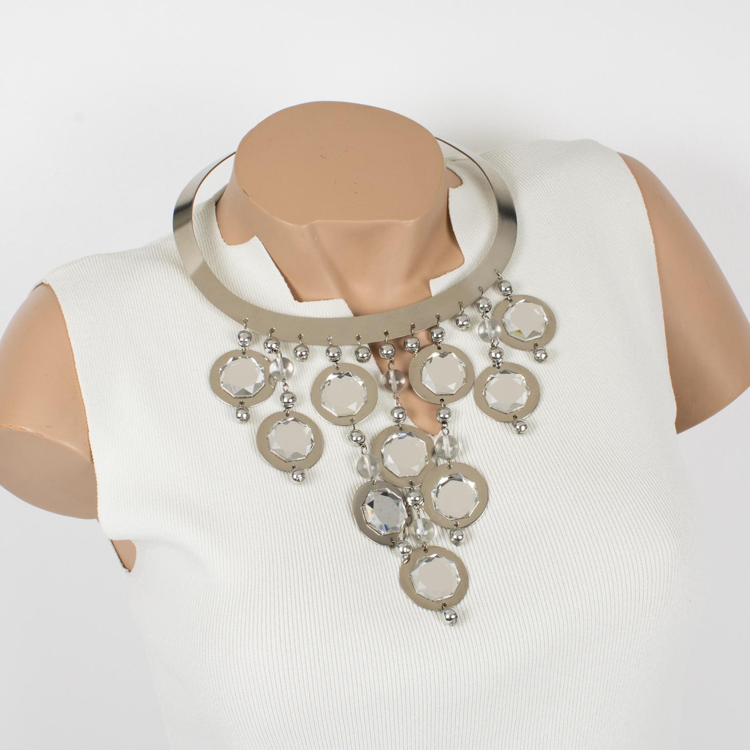 Louis Feraud Paris designed this spectacular sculptural Space Age collar pendant necklace in the 1960s. It features a chromed metal rigid oval neckband with a hook-closing clasp. The choker necklace is ornate with multiple charms dangling drops made