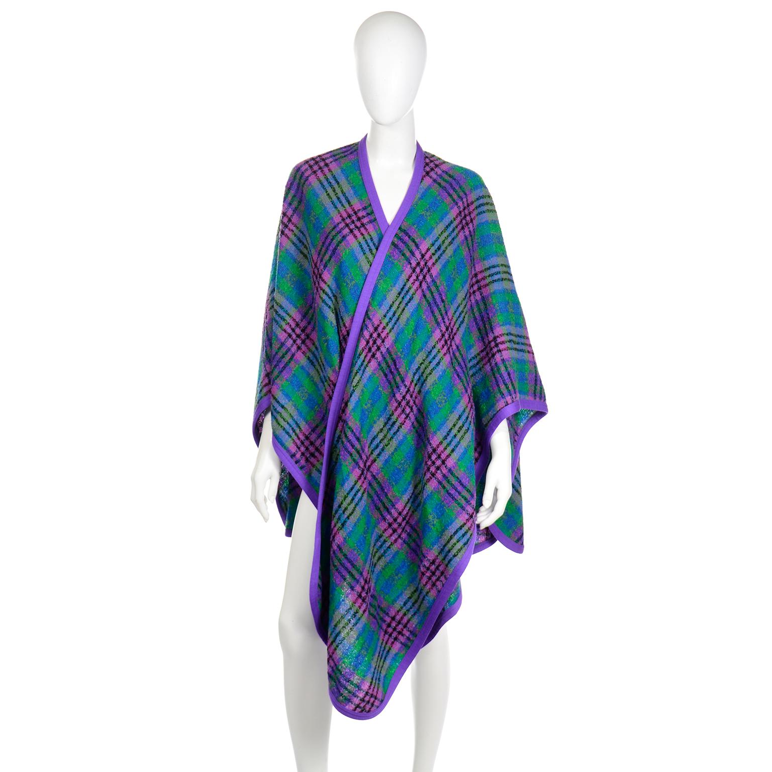 This vintage open front Louis Feraud Purple and Green cape style wrap would be such a great addition to your wardrobe!  This fabulous plaid wrap is so easy to throw on to add instant style to any outfit. We love wraps like these because they can be