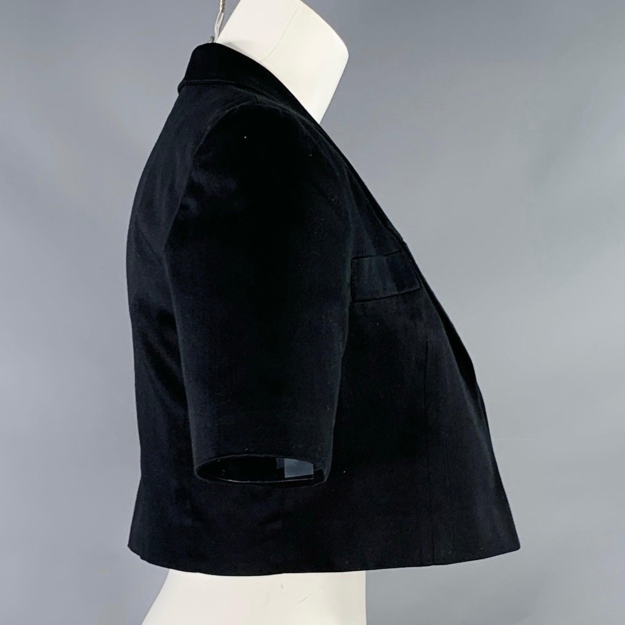 LOUIS FERAUD blazer
in a black cotton woven fabric featuring a cropped design, short sleeves, and open front.Excellent Pre-Owned Condition. 

Marked:   FR 36 

Measurements: 
 
Shoulder: 16 inches Bust: 35 inches Sleeve: 10 inches Length: 15 inches
