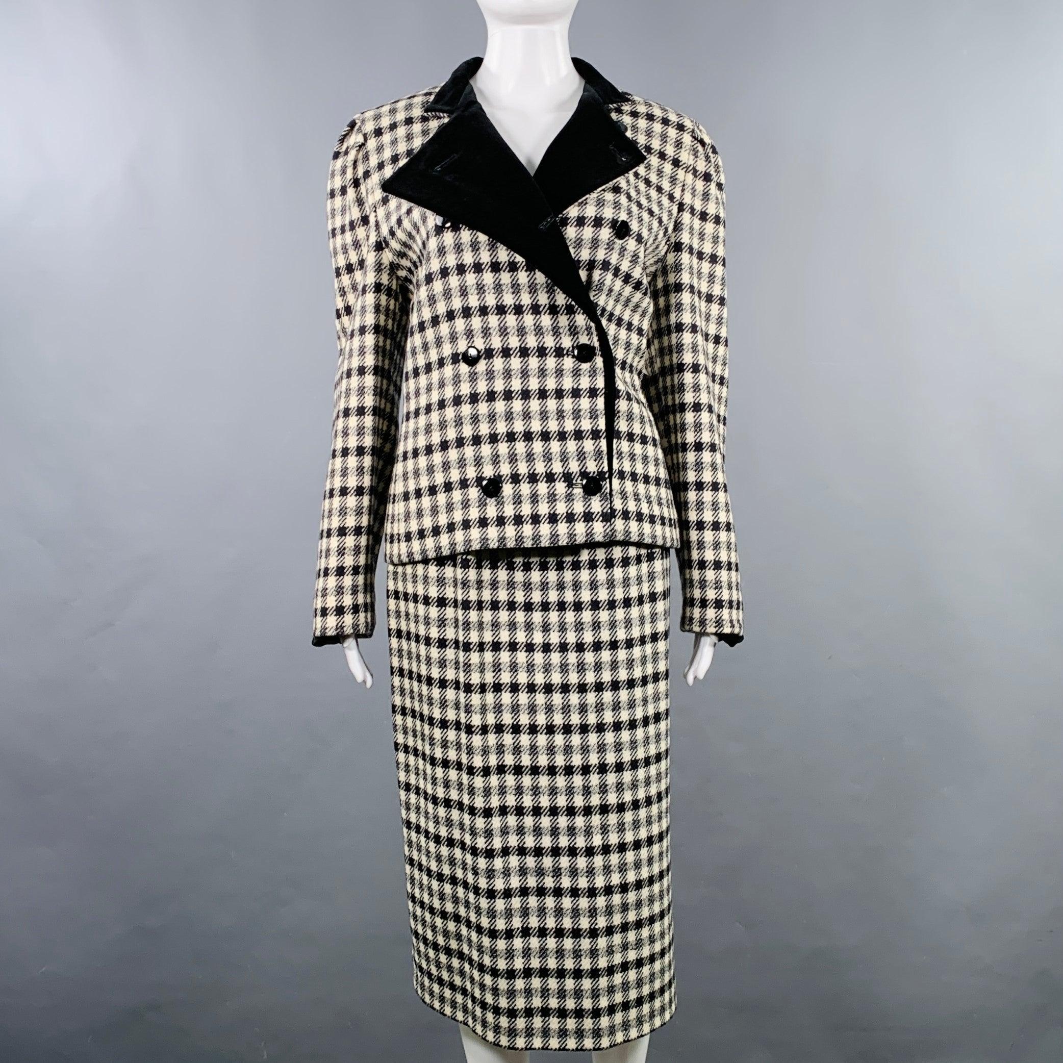 LOUIS FERAUD Ensemble jupe
en laine pied-de-poule noire et crème, comprenant une veste à double boutonnage avec garniture en velours de coton et une jupe crayon assortieTrès bon état d'occasion. 

Marqué :   FR 40 

Mesures : 
  -VesteEpaule : 15.5