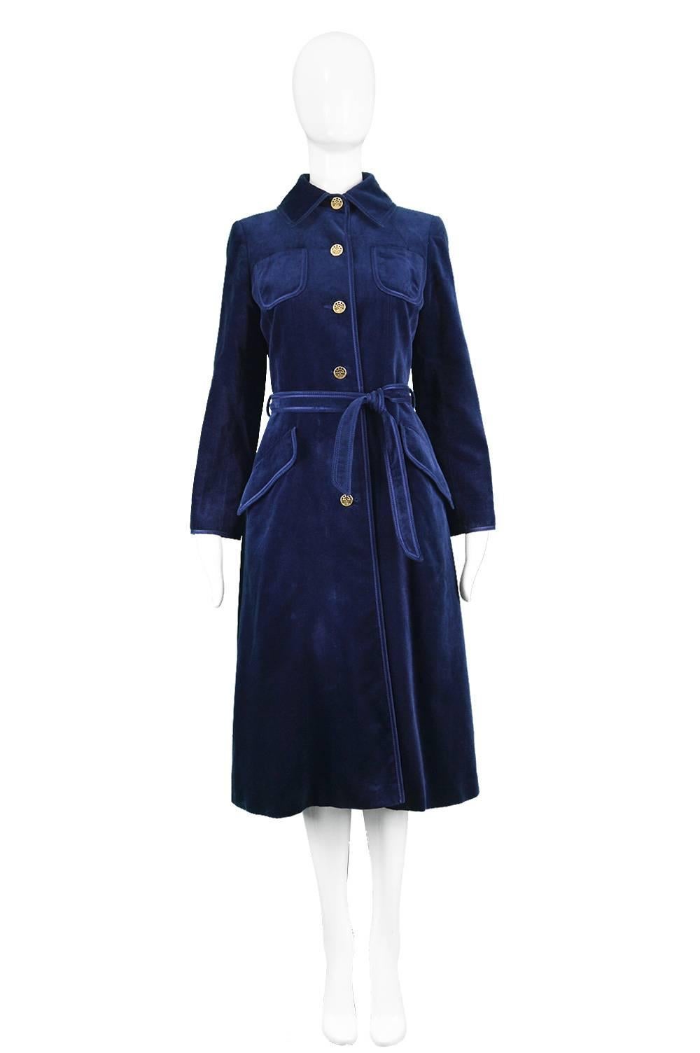 Louis Feraud Vintage 1970s Women's Midnight Blue Velvet Belted Trenchcoat

Estimated Size: UK 8-10/ US 4-6/ EU 36-38. Please check measurements.  
Bust - 34” / 86cm
Waist - 28” / 71cm
Hips - 40” / 101cm
Length (Shoulder to Hem) - 44” /