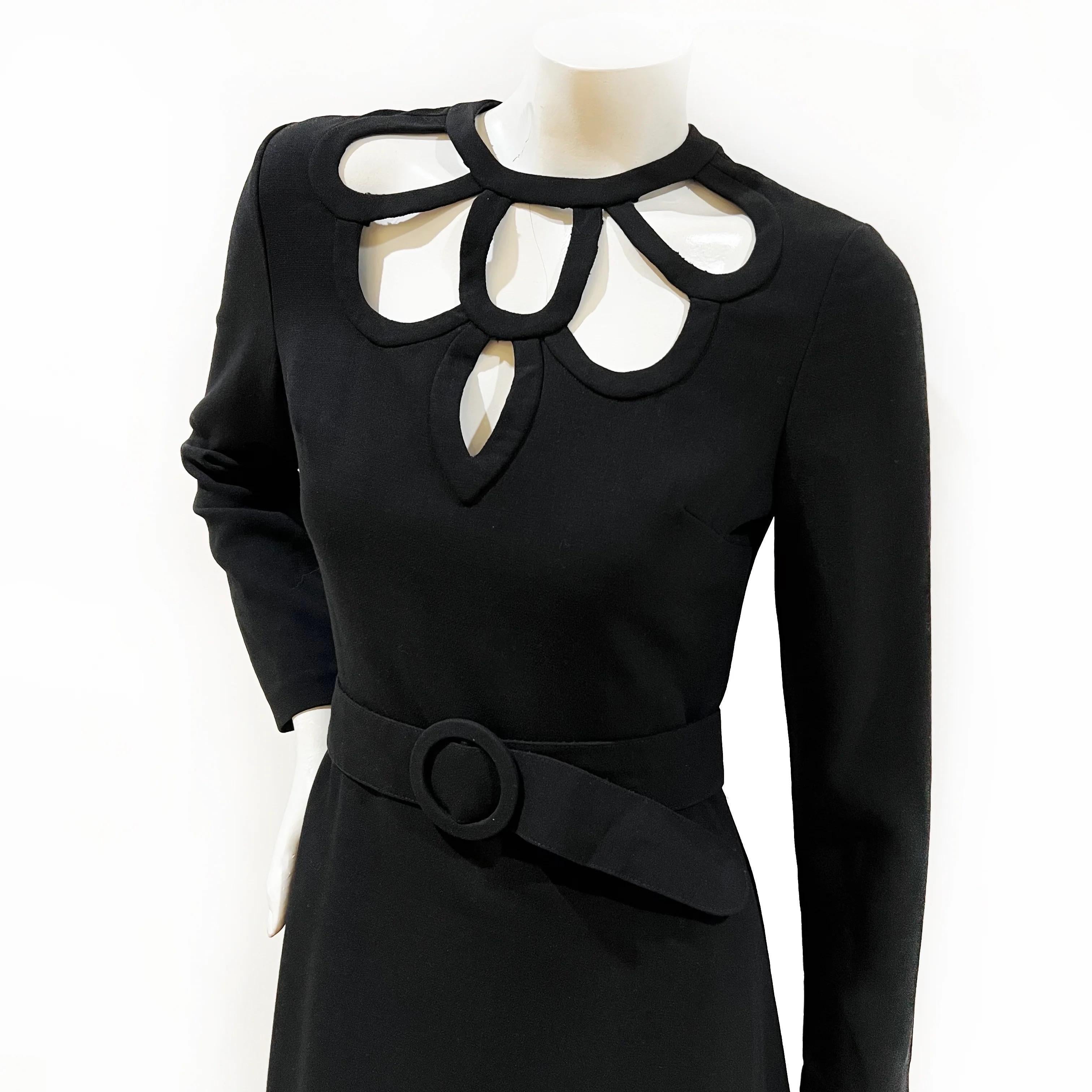 Louis Feraud Vintage 1974 Black Wool Blend Cut Out Maxi Dress

Decorative cutout neckline designer dress by Louis Féraud
Made in Germany 
1974
Black 
Full-length 
Long sleeves with functional cuff zippers
Scalloped keyhole cutouts along neckline