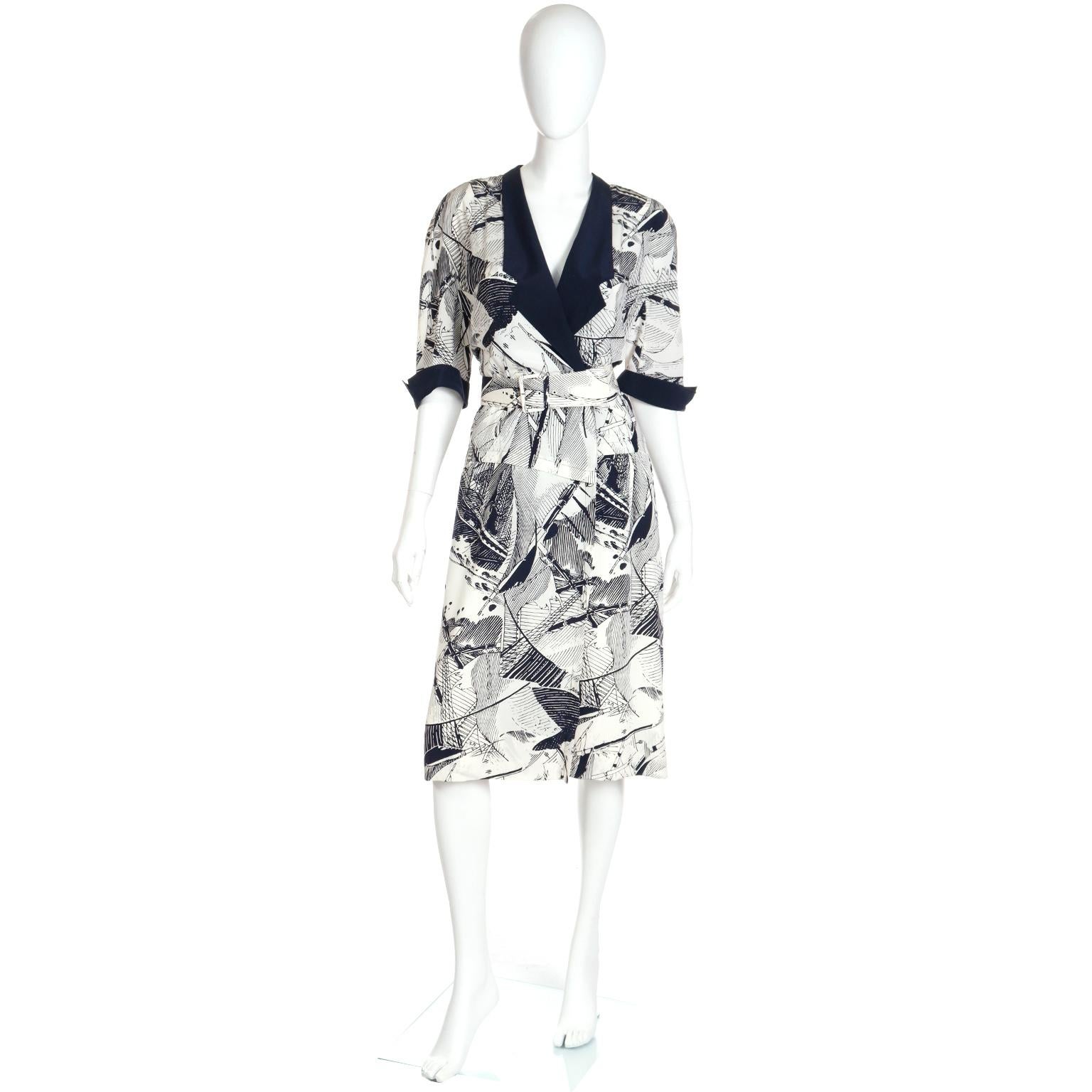 This is such a great novelty print summer dress by Louis Feraud in navy blue and white silk with viscose lining in the skirt. The dress is double breasted in the bodice and then there are hidden buttons to the hips. The notched collar and upturned