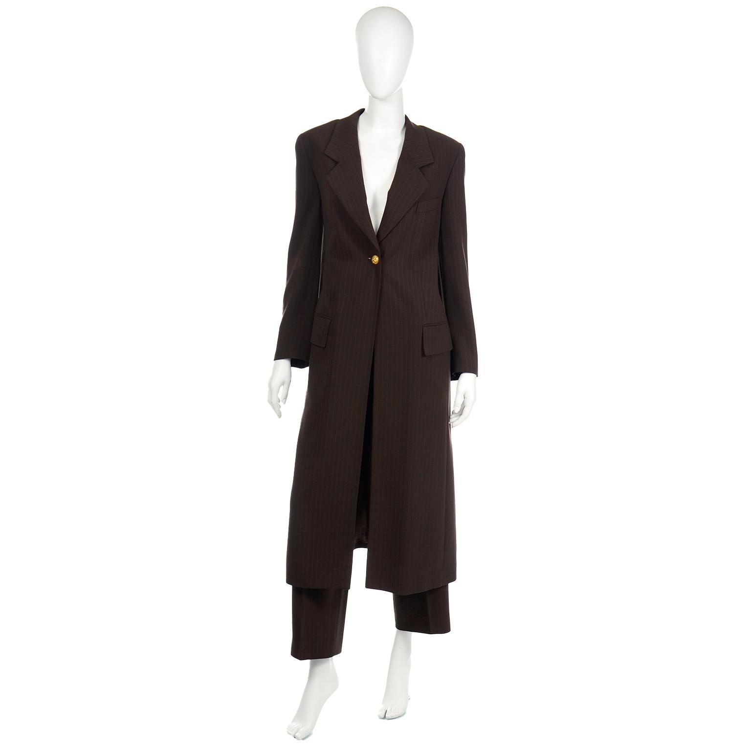 This sophisticated vintage Louis Féraud brown pinstripe pant suit includes a stunning blazer style coat and a pair of pleated trousers. This outfit can be worn as a suit or you can break it up and have two great separate pieces to wear with other