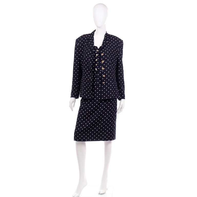 This is a vintage Louis Feraud 3 piece navy blue and white polka dot rayon skirt , top and jacket suit. Louis Feraud pieces are always beautifully made and we always love finding them. We also really love the versatility that suits offer because