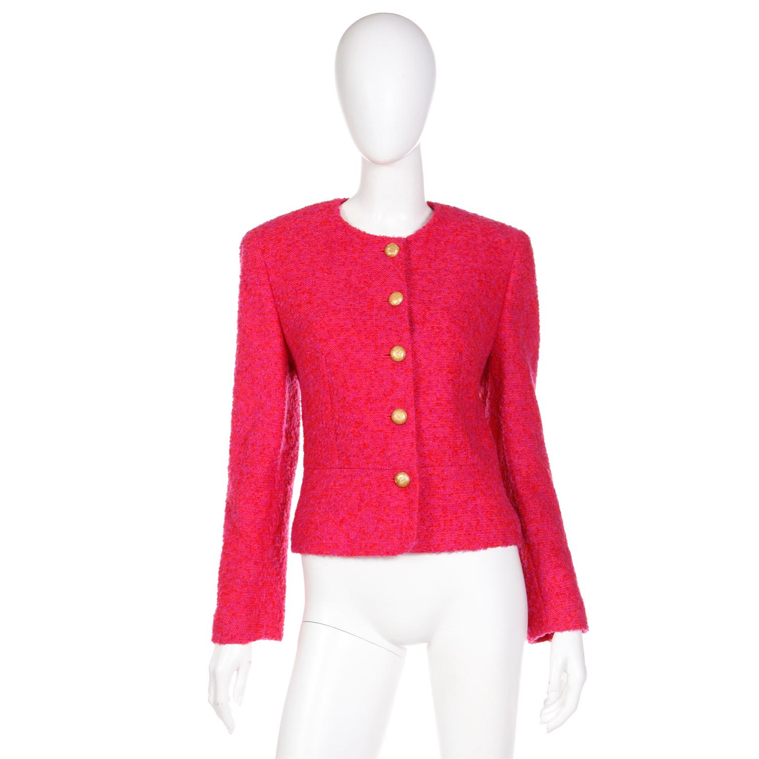 This fabulous vintage Louis Feraud cropped jacket is in a raspberry pink / red and purple boucle mohair wool blend. This round neck, collarless jacket has textured gold buttons down the center front and at the cuffs of the sleeves. The jacket is