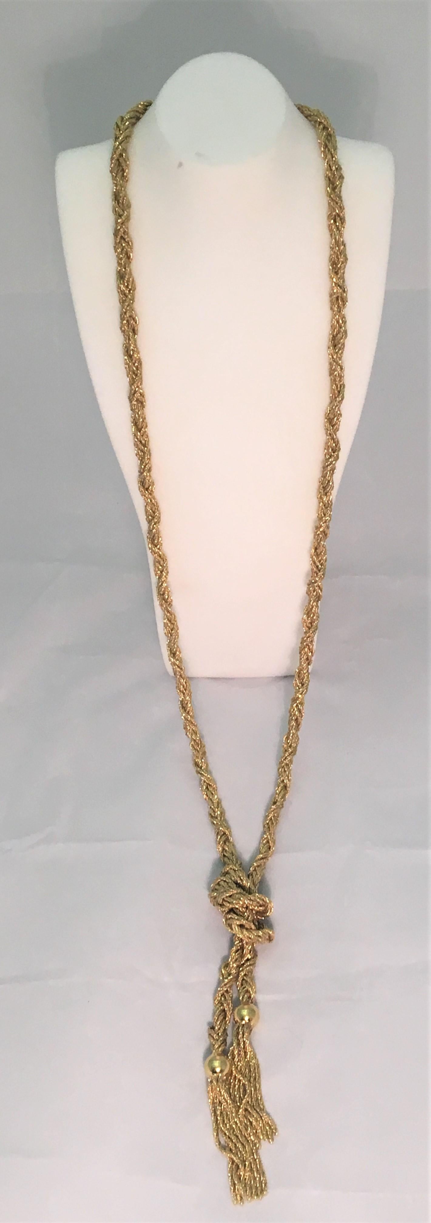 This beautiful necklace can be worn several ways!
18 karat yellow gold long braided necklace with tassels on each end
Can be worn knotted, long, wrapped/tied for a different style or even as a belt!
Approximately 5mm thick
Approximately 40 inches
