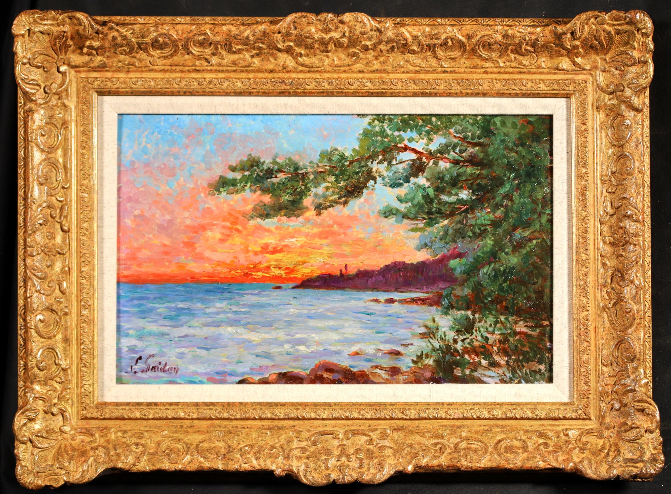 Signed costal landscape oil on panel circa 1890 by French neo-impressionist painter Louis Gaidan. The piece depicts a sunset creating orange and red light on the horizon beyond a rocky shoreline in Carqueiranne, in the Cote d'Azur in Southeastern