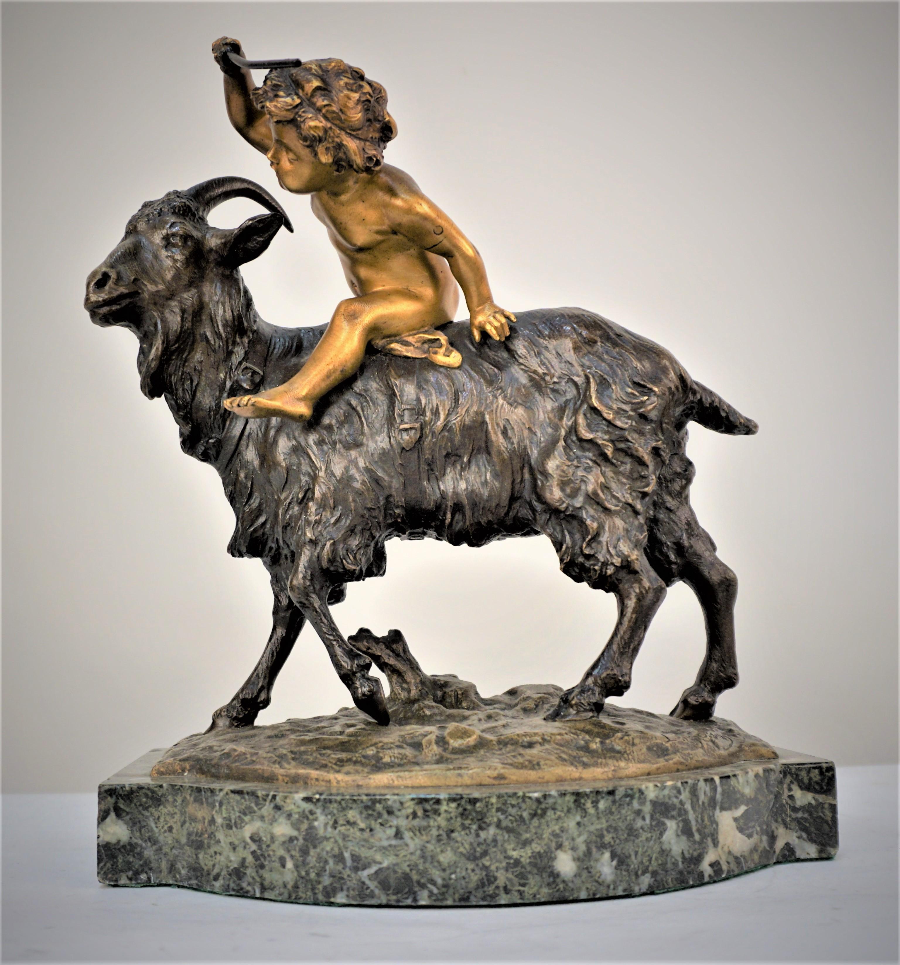 Louis Gossin boy riding a goat bronze sculpture (French. 1846-1928)
Gilt bronze boy riding brown bronze goat over marble with green, white and black texture.