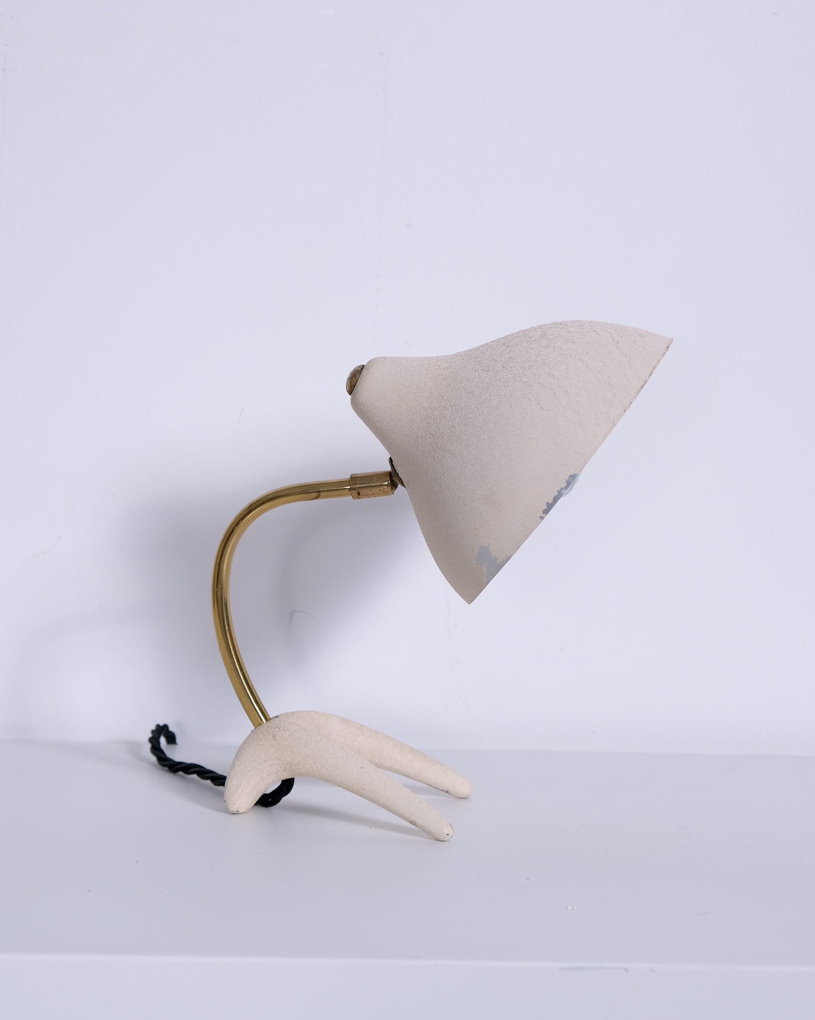 c.1950s
Aluminium lampshade, brass neck and metal base
H19 x D13.5 cm 
Made for Phillips, Netherlands