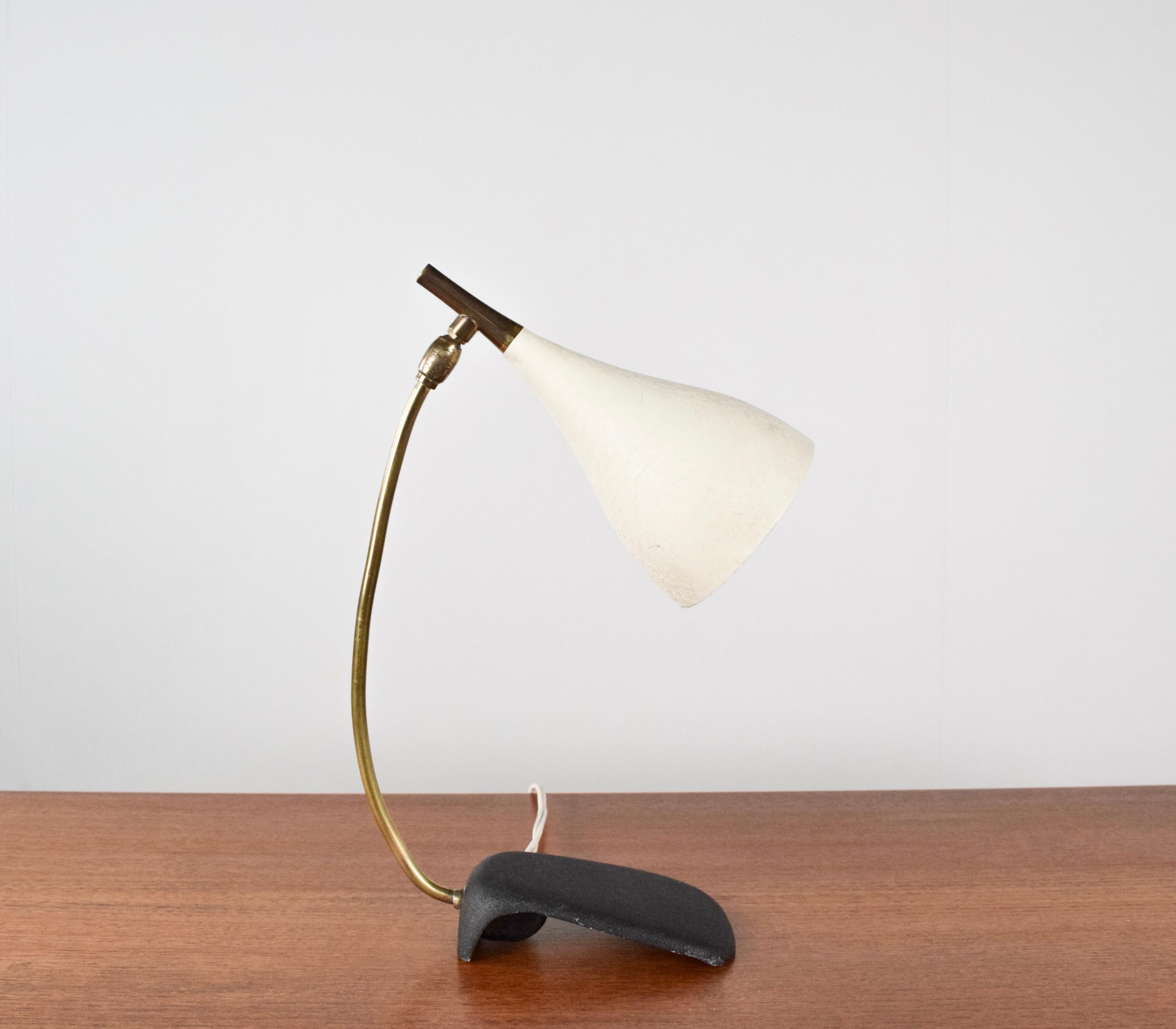 Minimalist Philips desk lamp by Gebrüder Cosack, Germany 1950's . This lamp has a hood of white lacquered aluminium, a cast iron foot and a curved brass base. This lamp is very stylish and functional and is a great addition to your interior. It is