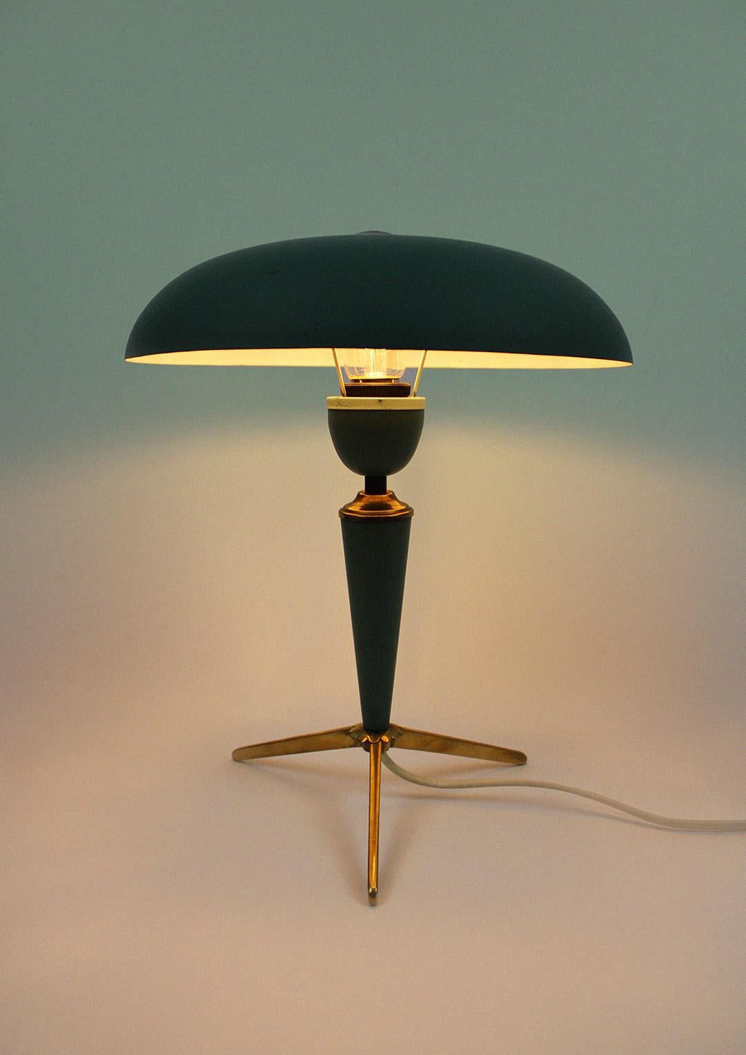 The stylish 'Bijou' desk or table lamp by Dutch designer Louis Kalff, which was made for the manufacturer Philips is a beautiful icon from the Spage Age era. This 1950s model is in particularly good condition and consists of metal and brass. The