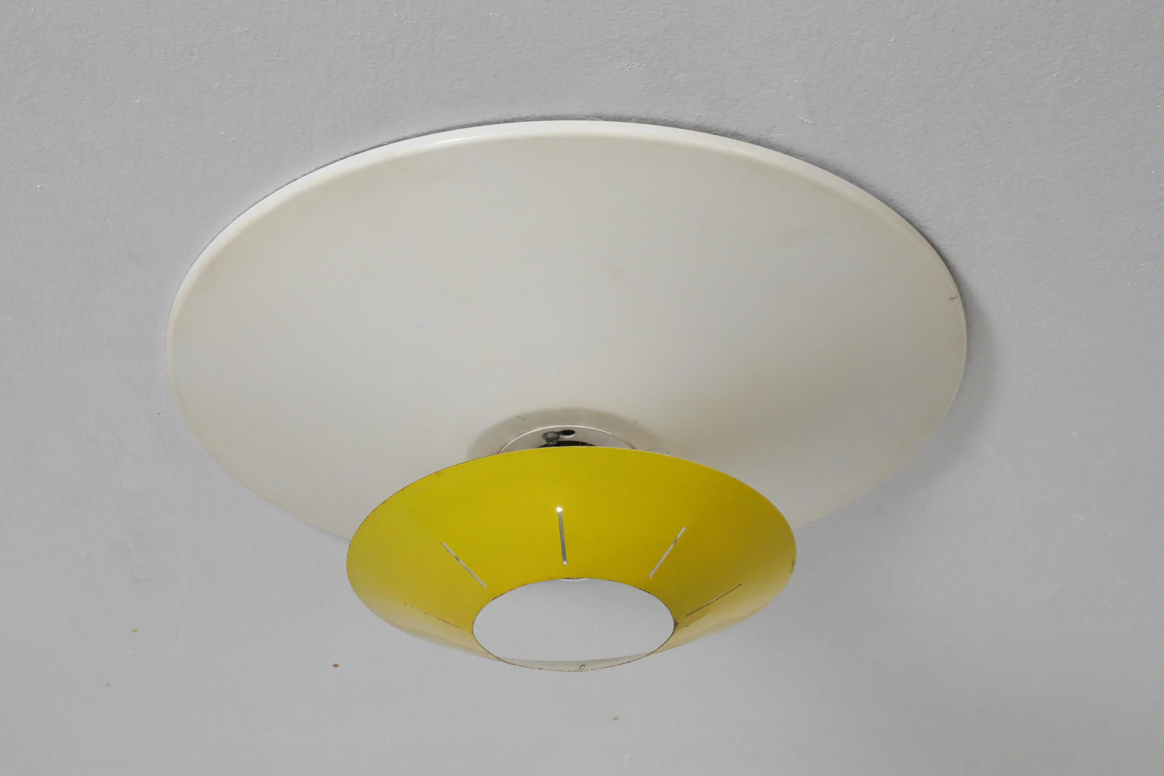 Mid-Century Modern Louis Kalff Yellow and White Enameled Metal Ceiling or Wall Lamp for Philips For Sale