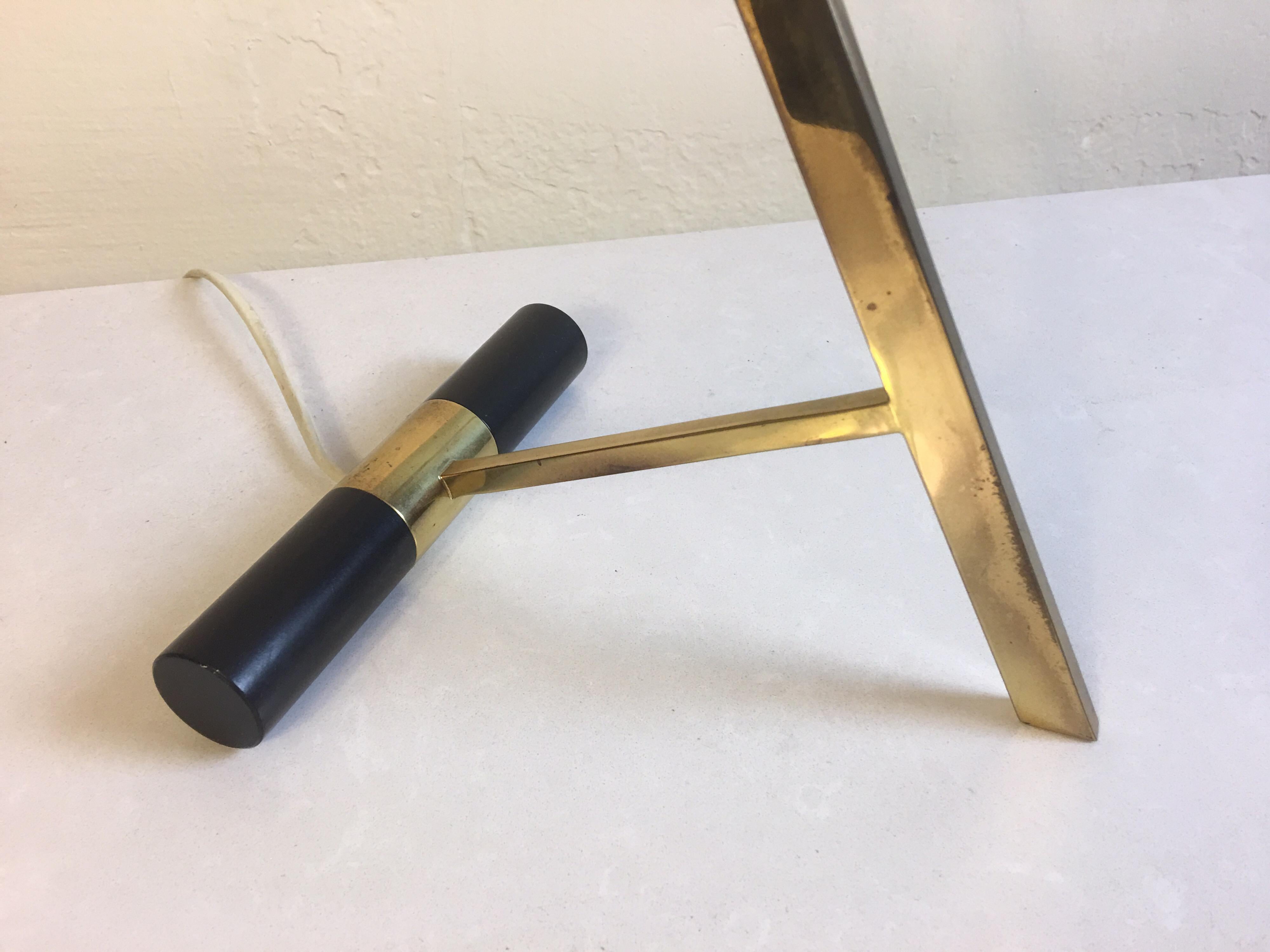 Z-shaped desk or table lamp designed by Louis Kalff for Philips Lighting of the Netherlands. Makers mark pictured. Very clean example of this lamp. Nice in line period switch and wiring. Brass is still bright and black shade very clean.