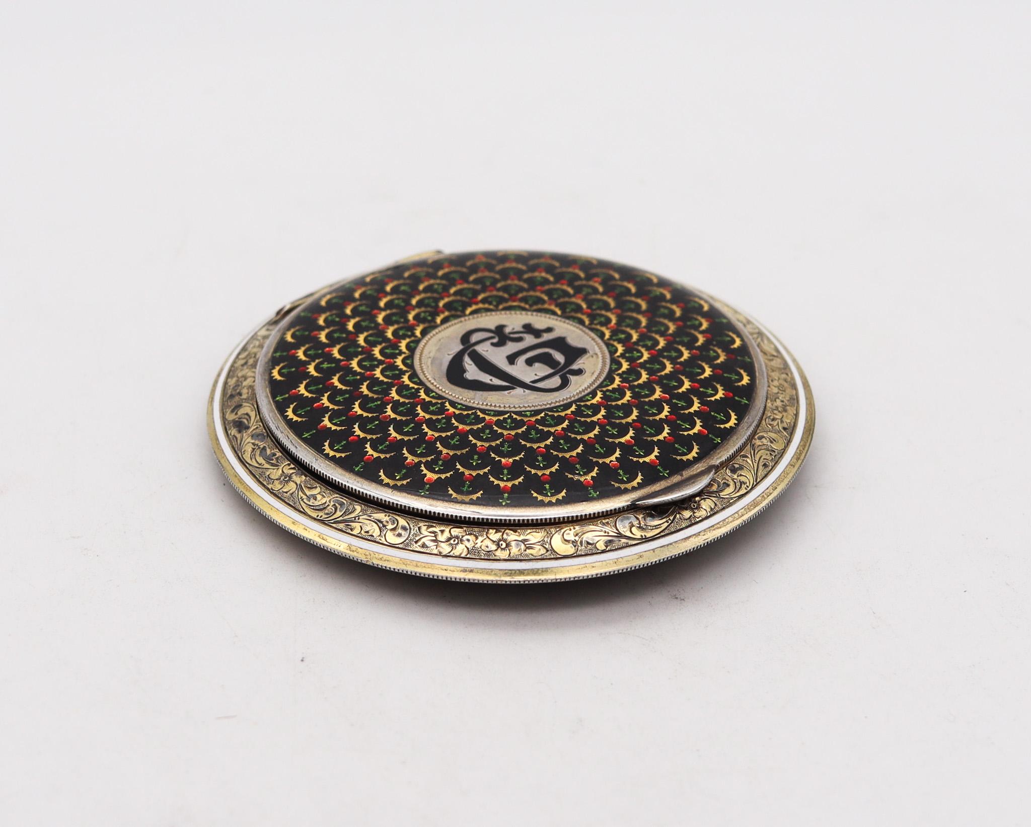 Enameled compact box by Louis Kuppenheim for Alfred Dunhill. 

An extraordinary round compact box, created in the city of Pforzheim Germany during the art deco period, back in the late 1920's. This superb elegant round box is closely to mint