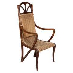 Louis Majorelle. Art Nouveau carved walnut armchair with original period fabric