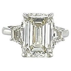 Louis Newman & Co 4.05 carat Emerald Cut GIA certified Diamond Three Stone Ring