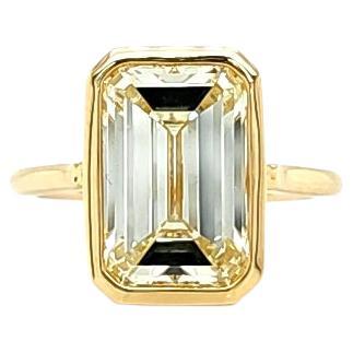 Louis Newman & Co 5.09 Carat Emerald Cut Emerald Cut Bezel Set Yellow Gold Ring For Sale