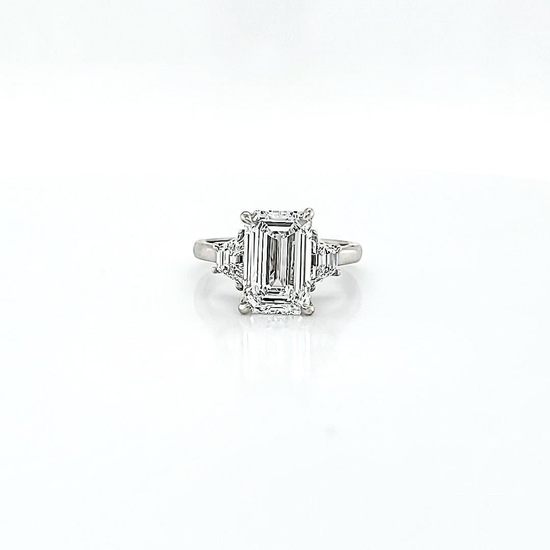 Louis Newman & Co GIA Certified 3.01 Carat Emerald Cut Diamond Three Stone Ring In New Condition For Sale In New York, NY