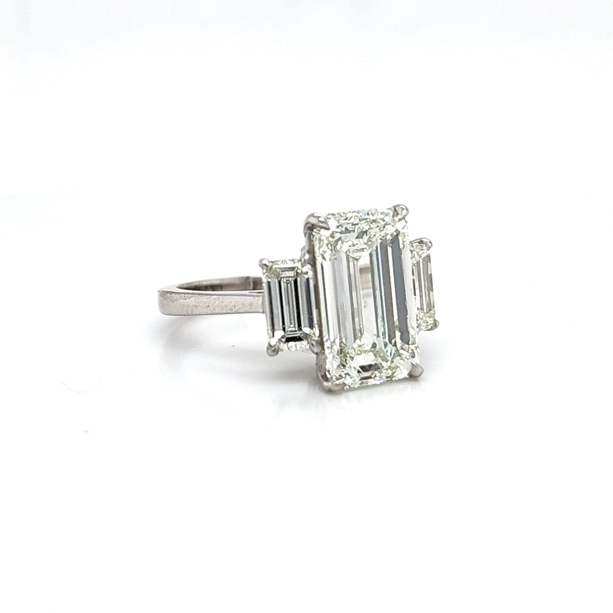 Women's or Men's Louis Newman & Co GIA certified 5.11 carat Emerald Cut Diamond Three Stone Ring For Sale