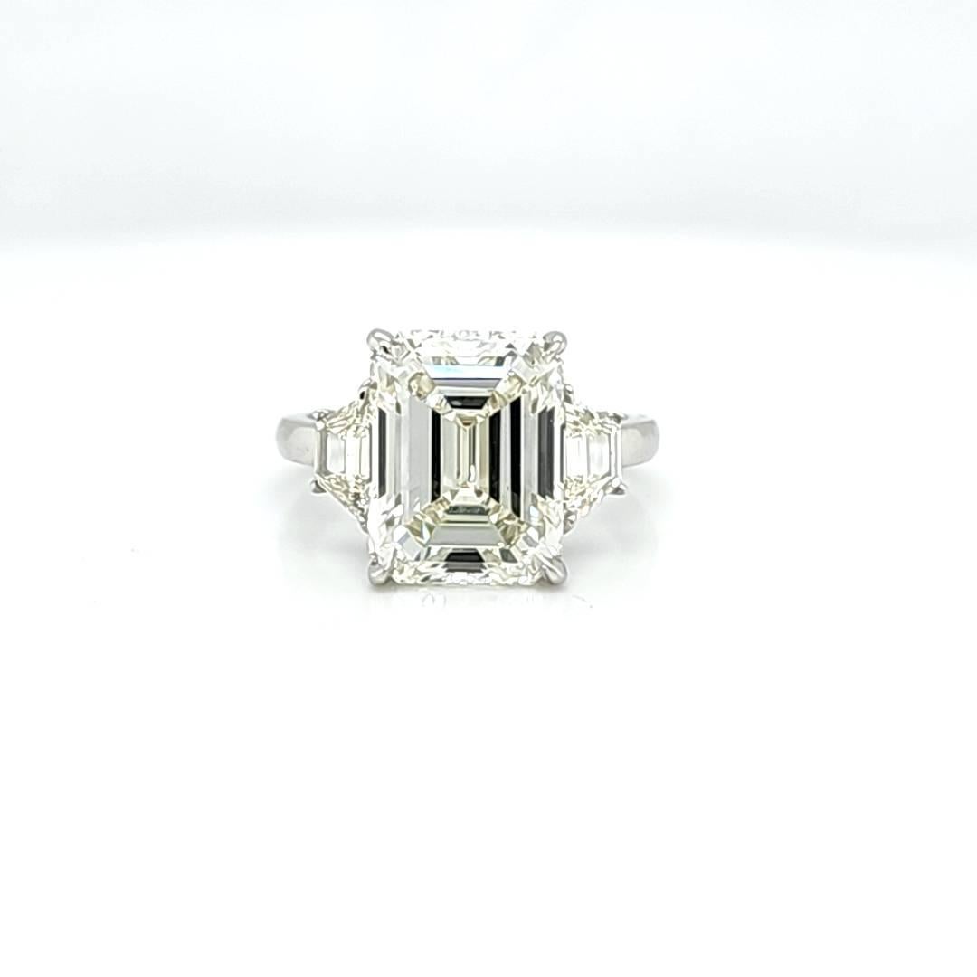 Louis Newman & Co GIA Certified 6.11 Carat Emerald Cut Diamond Three Stone Ring For Sale 1