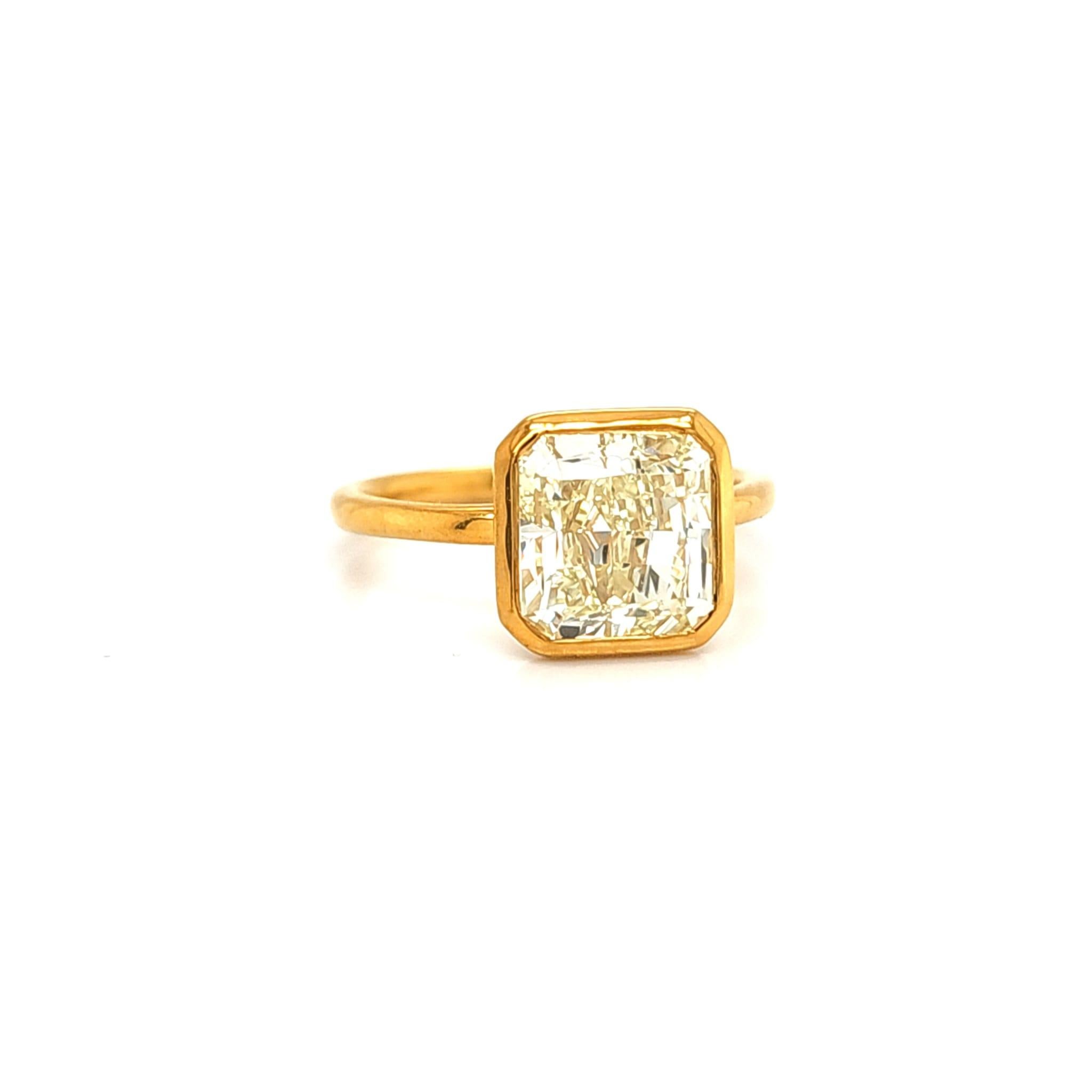 Radiant Cut Louis Newman & Company GIA certified 3.15 carat Yellow Diamond Bezel Ring