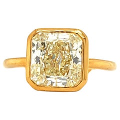 Louis Newman & Company GIA certified 3.15 carat Yellow Diamond Bezel Ring